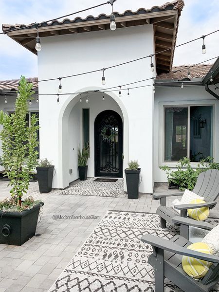 Current Courtyard View!😎 

✨Are you thinking about hanging string lights in your outdoor space to create some ambience? I have a tutorial saved to my highlight called Bistro Lights!✨ 

#modernfarmhouseglam 

#LTKhome #LTKSeasonal