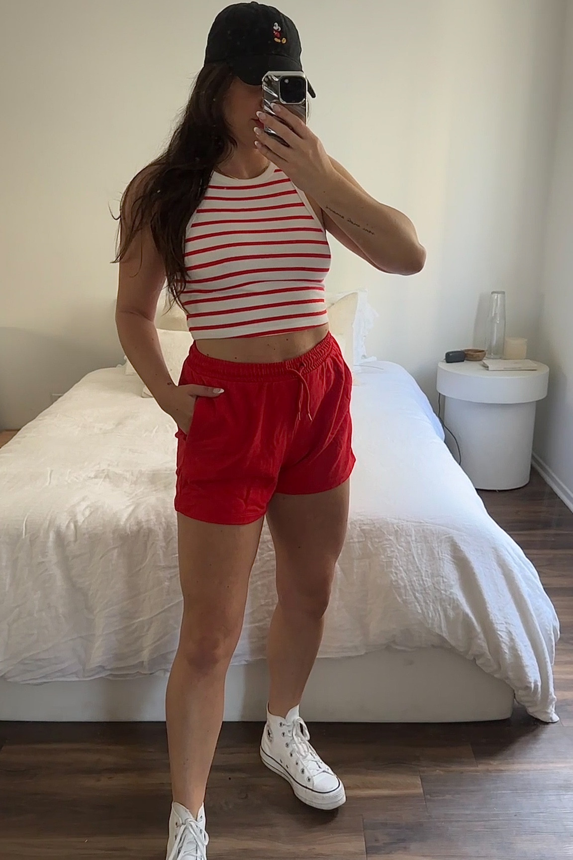 Disney Outfit Idea Five: H&M tank top, H&M sweat shorts, white leather platform converse, Amazon Mickey Mouse hat.

#LTKstyletip #LTKtravel #LTKunder100