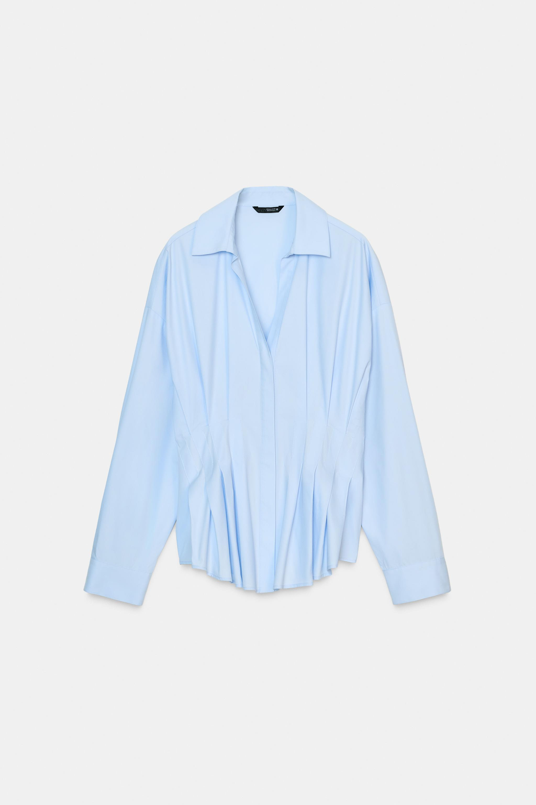 Shirt with lapel collar, V-neck, and long sleeves. Pleat detail at waist. Front closure with conc... | Zara US