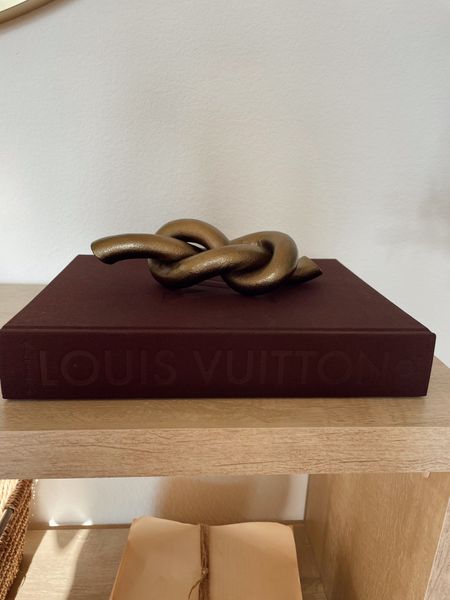 Louis Vuitton coffee table book 😍😍 chocolate brown coffee table book. Neutral home decor. Knot decor. Metal knot  

#LTKsalealert #LTKstyletip #LTKhome