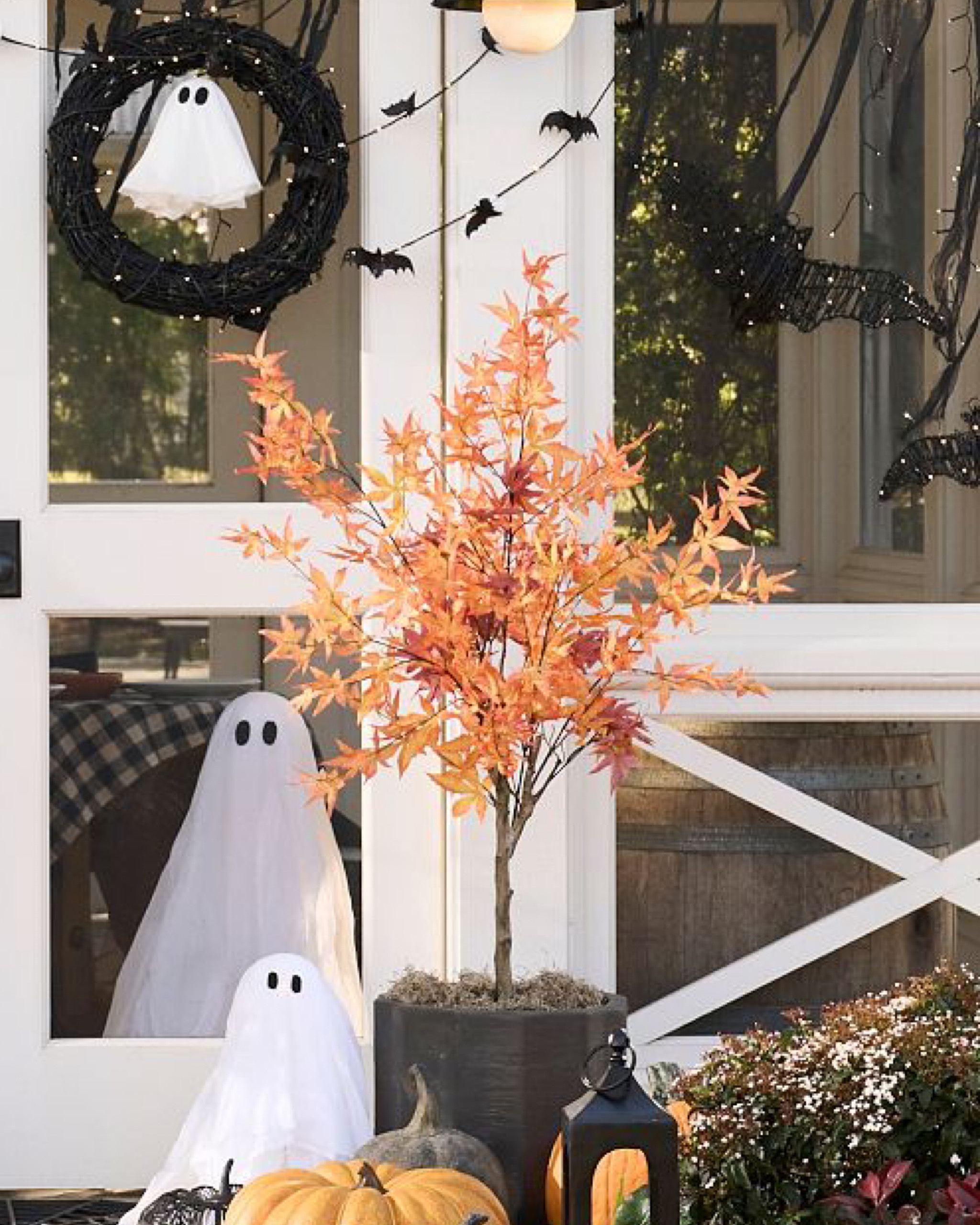 Halloween Wreath with friendly ghost. Lit faux autumn leaf tree. Ghosts and faux pumpkins. Perfect Halloween outdoor decor. 

#LTKHalloween #LTKhome #LTKSeasonal