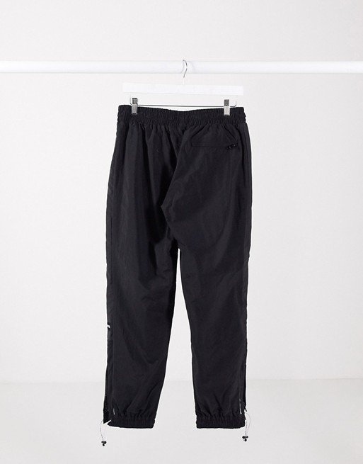 Puma King logo zip trackpants in black | ASOS (Global)