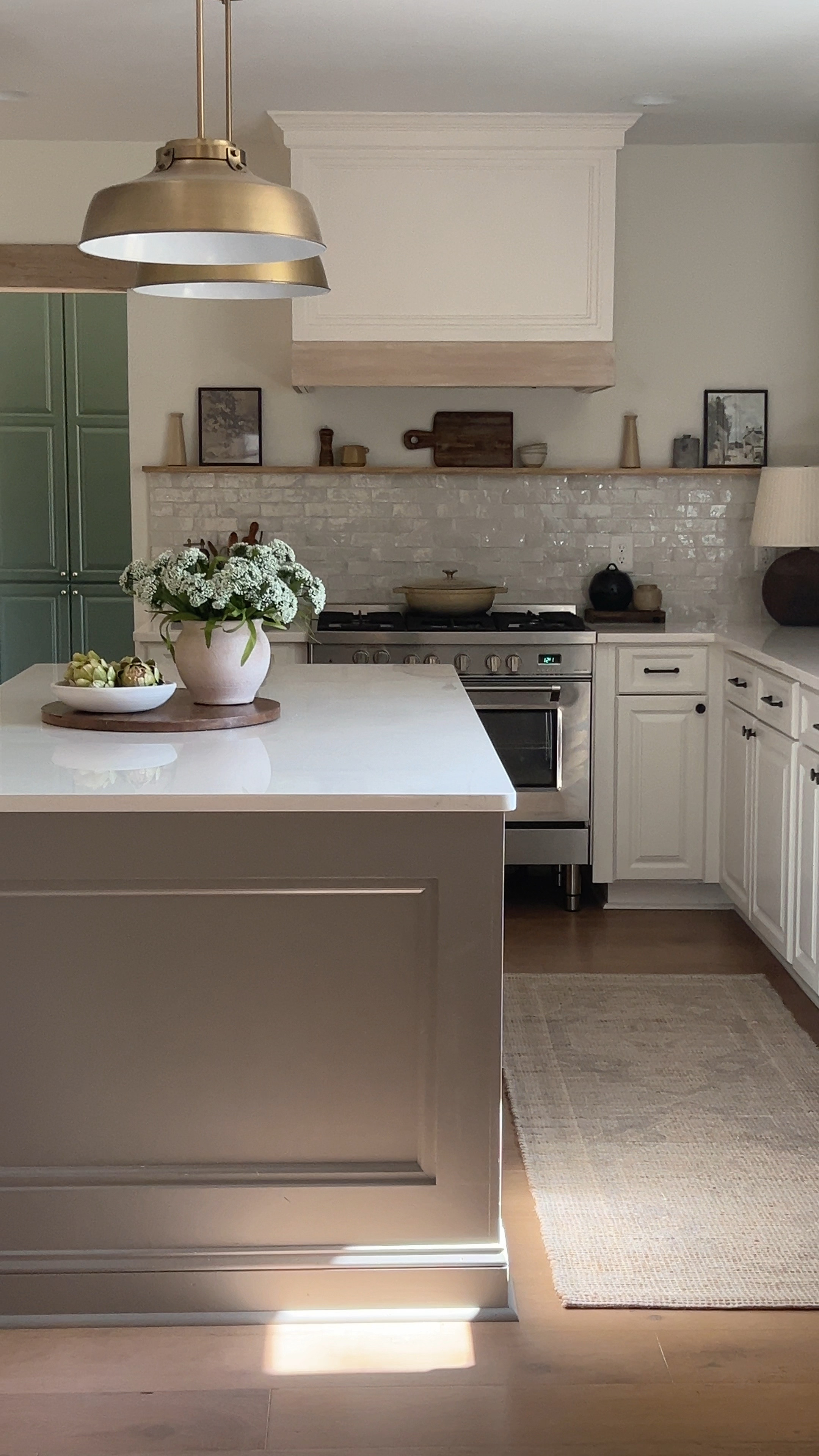 Kitchen decor | kitchen runner | white kitchen | zellige tile | kitchen pendant light | oven | stove | range | hardware | bowl | artichokes | spring decor | spring stems | centerpiece ideas 

#LTKhome #LTKfindsunder100 #LTKfindsunder50