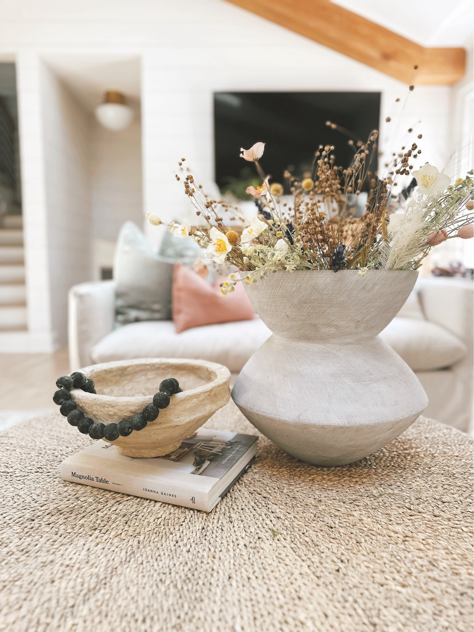 Spring faux stems, coffee table decor, coffee table styling, coffee table, round coffee table, coffee table vases

#LTKStyleTip #LTKHome #LTKSaleAlert