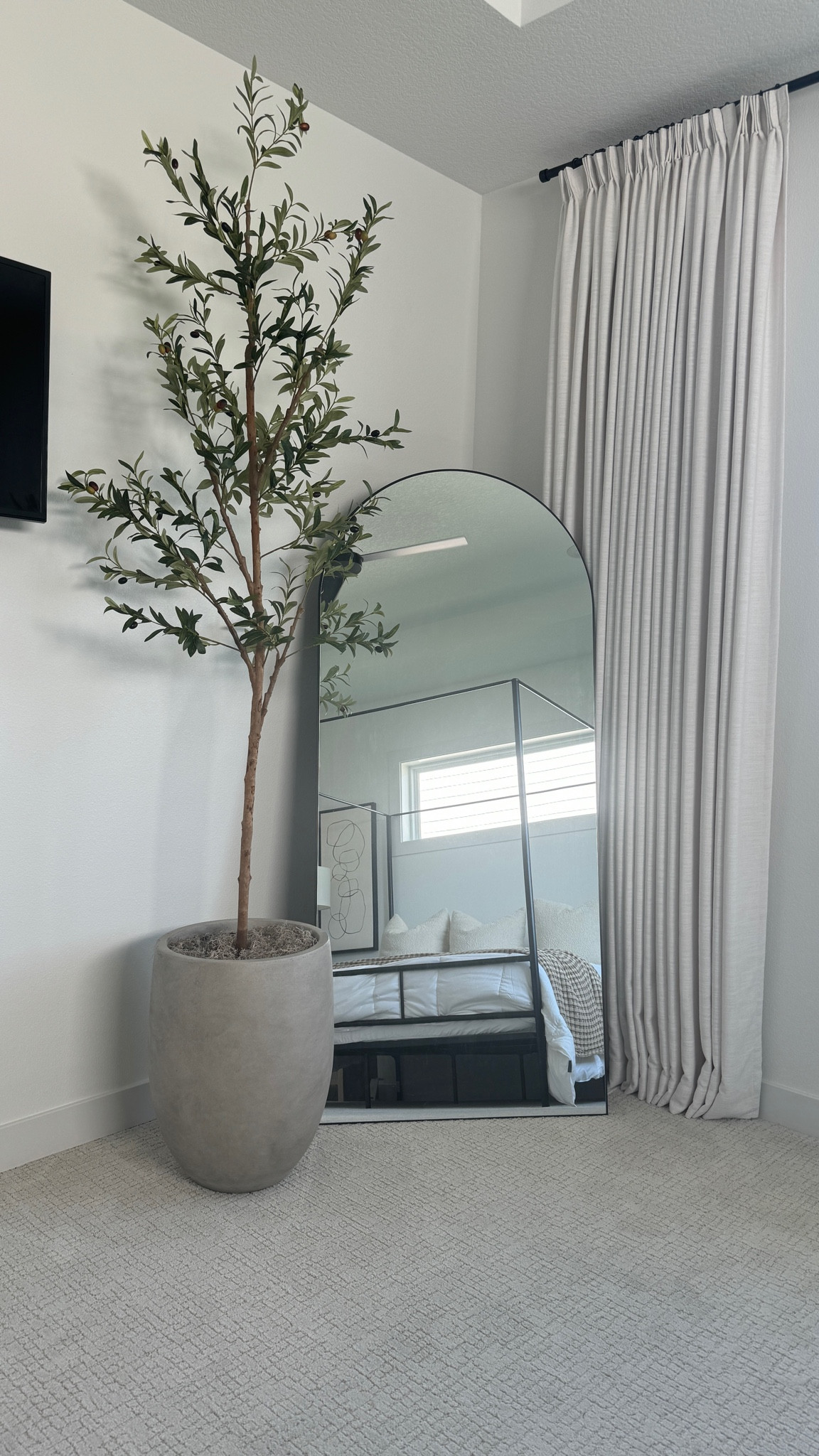 Amazon olive tree, neutral planter and arched floor mirror.

#LTKFindsUnder50 #LTKHome #LTKStyleTip