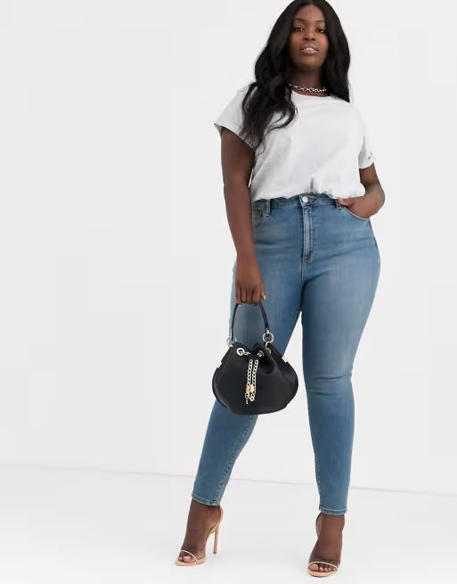 ASOS DESIGN Curve Ridley high waisted skinny jeans in pretty mid stonewash blue | ASOS (Global)