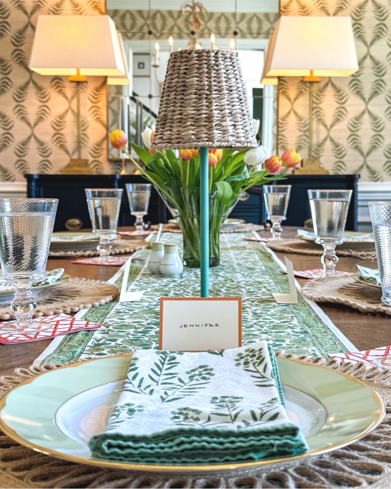 From the tablecloth to the place cards, Mary always curates a simply elegant table. Fresh tulips and cocktail napkins add a pop of color, and rattan chargers and lamp shades round out a beautiful, ready-for-summer tablescape.

#LTKParties #LTKHome