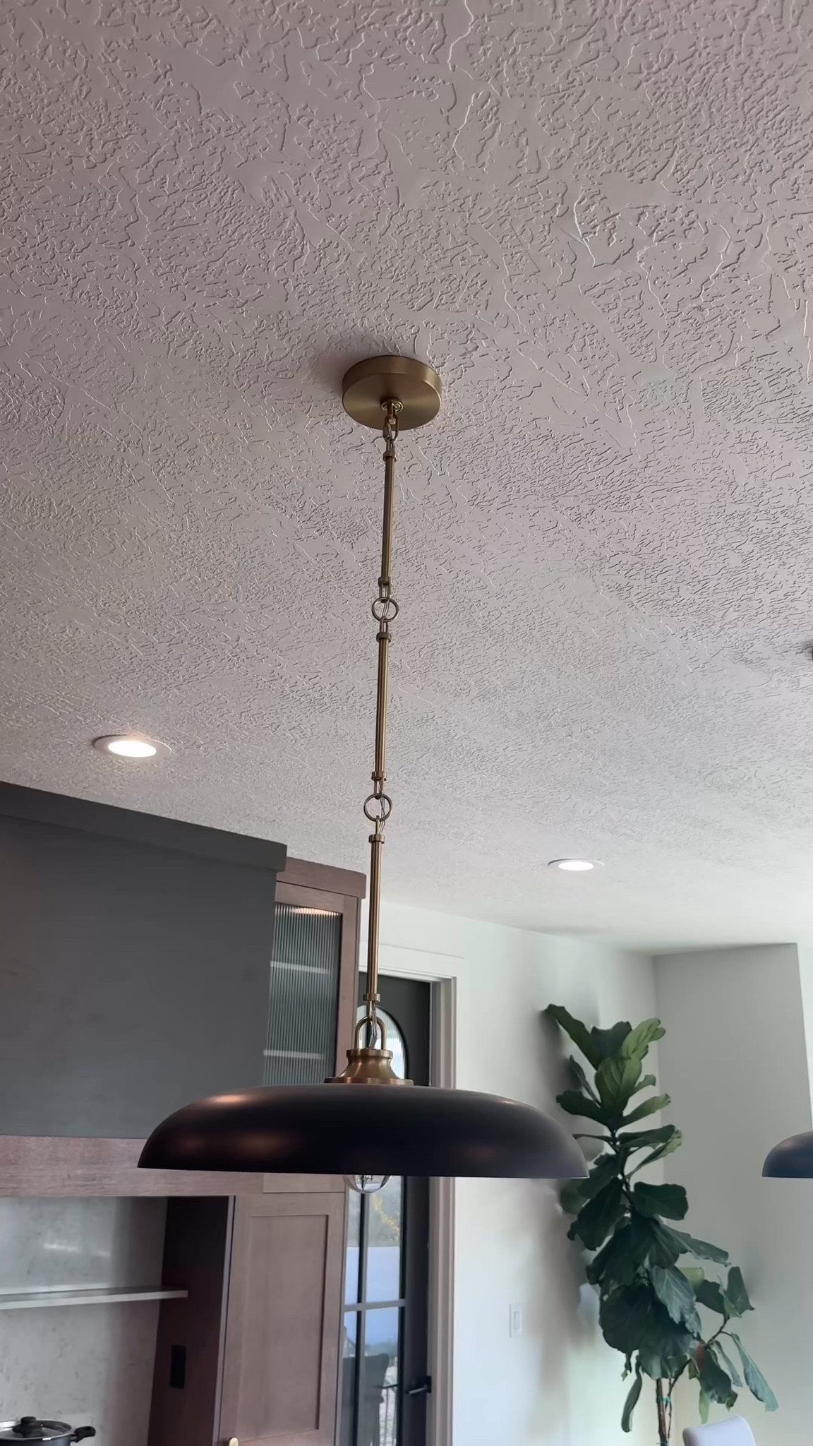 Love the unique saucer shape of this Hinkley pendant. It adds a modern touch without being too bold.