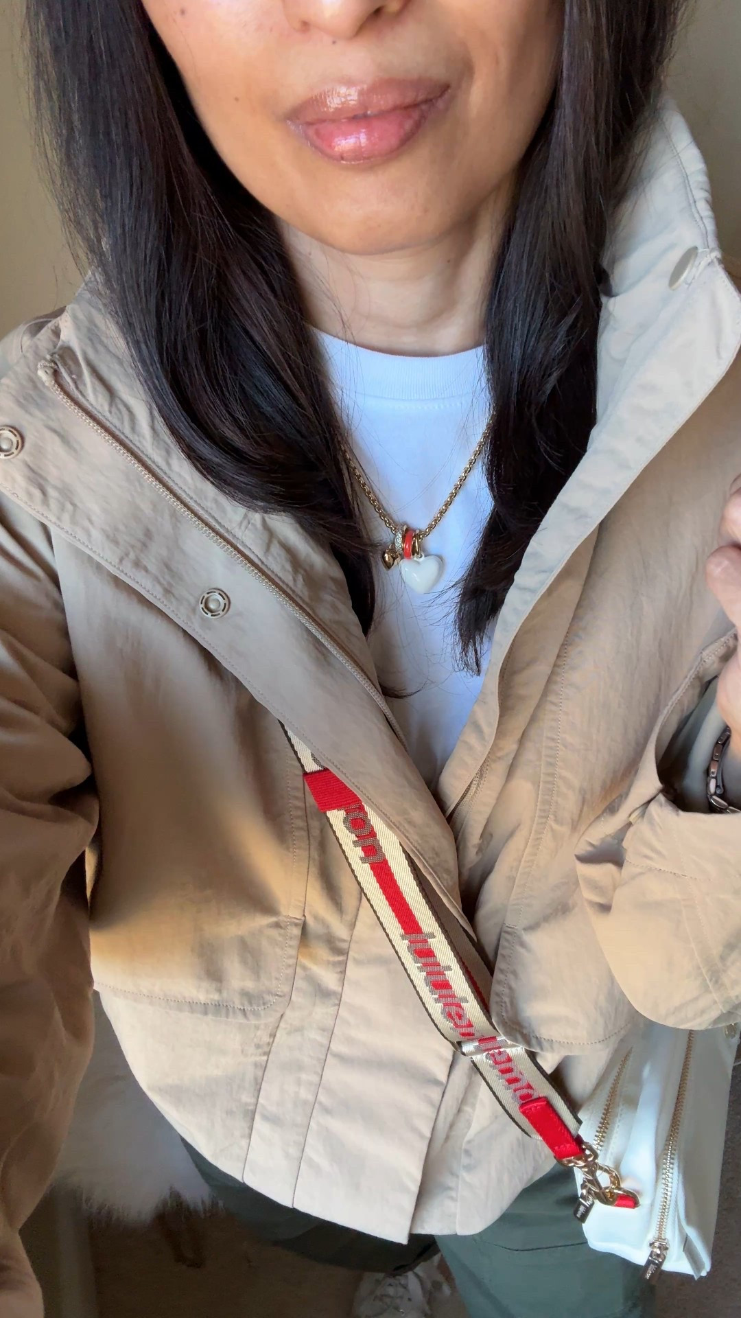 Spring jacket  Everyday casual Spring outfit. 
Timeless style with good basics: 
- khaki jacket 
- white t-shirt
- casual cotton pants 
- sneakers 
- crossbody bag
- everyday jewelry 

Exact items:
- jacket:  I love a funnel neck. This athleisure style has great details, seems good material/ quality, and has a hidden hood. I sized up here, but going to exchange for my true size. Perfect spring jacket and would be good for travel. 
- favorite white t-shirt: wearing a size up here but I also wear true to size. 
- olive pants: cute casual style that is a nice change up from jeans or black athleisure bottoms. Size down. 
- crossbody bag: the strap makes the bag with the perfect pop of red against neutral stripes. Perfect for everyday essentials or as a travel bag. 
- white sneakers: trending slim profile ballerina style. 
- everyday gold jewelry with a hint of color

#LTKActive #LTKOver40 #LTKTravel