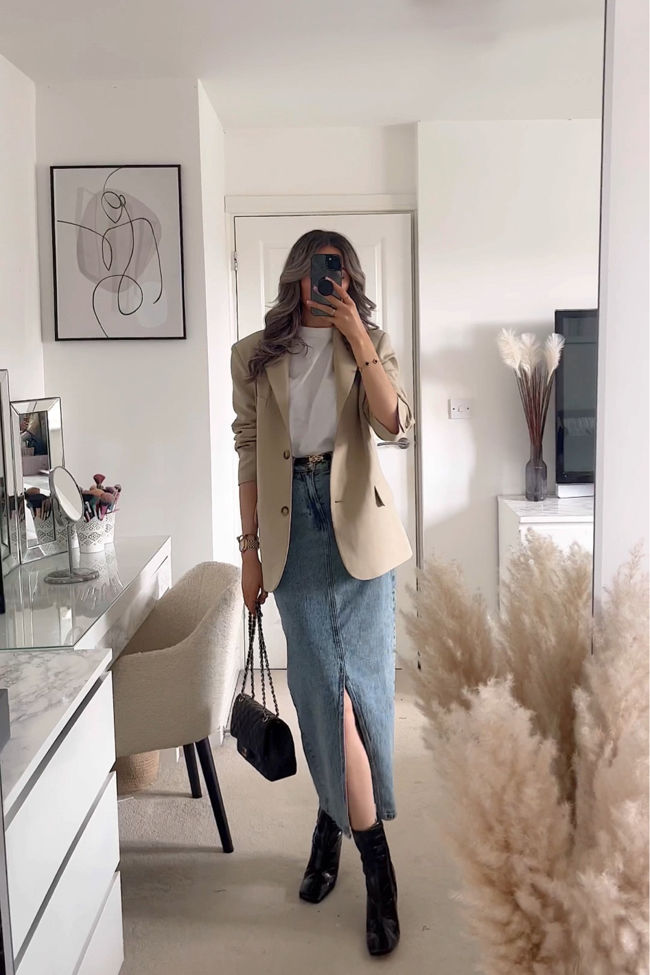 Chic spring outfit, white oversized T-shirt, beige oversized blazer, denim maxi skirt, black heeled boots.

#LTKSeasonal #LTKstyletip #LTKeurope