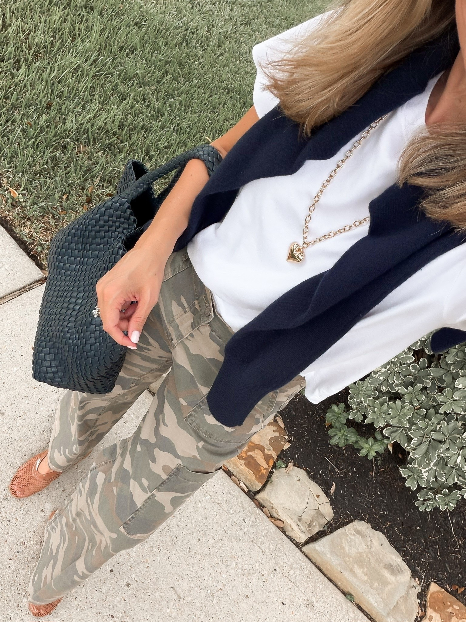 Camo pants are such a good way to make a simple fall outfit feel more interesting. I love them with a white tee, a navy sweater over the shoulders and woven flats for an easy mix of casual and put together.

camo pants, camouflage pants, white tee outfit, navy sweater, woven flats, casual fall outfit, utility pants, transitional fall style, everyday fall outfit, fall outfits over 40, women’s fall fashion, HauteandHumid