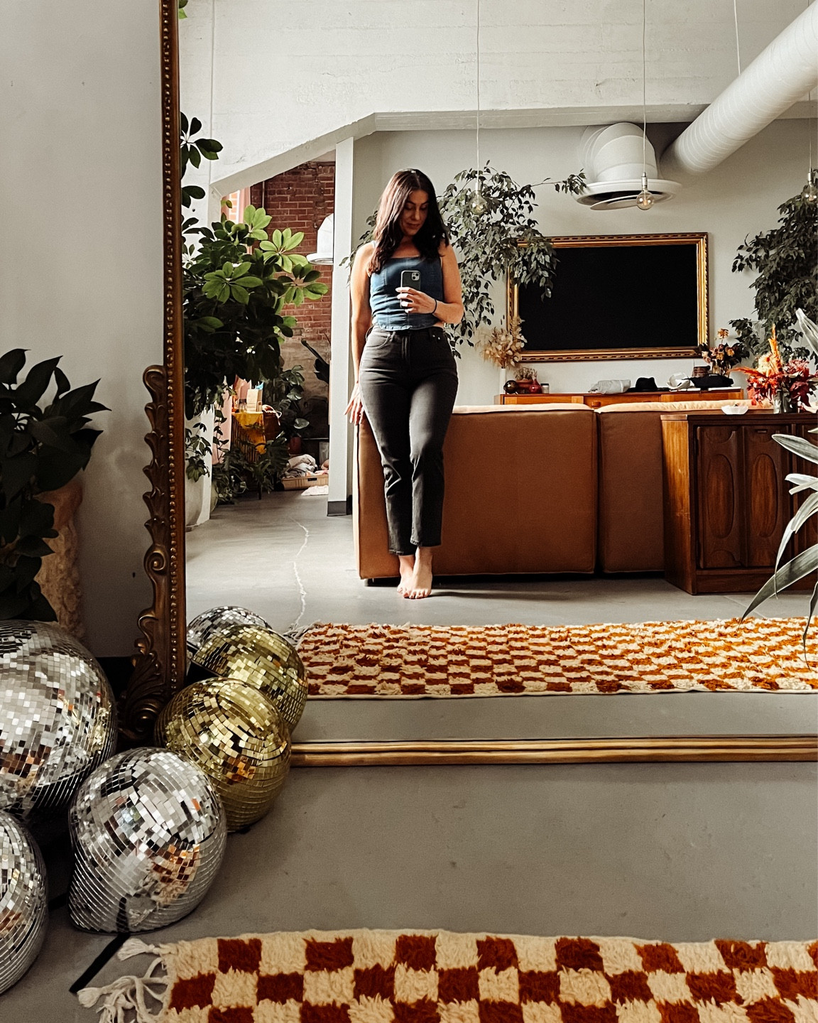 Denver, you were good.

Loved our airbnb with the vintage boho living room filled with plants, orange checkered rug, gold fram tv, Anthropologie floor mirror, and disco balls.

Was ready for my first red rocks show in my high waisted black jeans and denim corset tank, the perfect concert outfit idea. 

Denim tank
Madewell jeans
Vintage black jeans
Eclectic living room
Anthro dupe 
Anthro mirror
Anthropologie mirror
Anthropologie dupe

#LTKHome #LTKStyleTip #LTKTravel