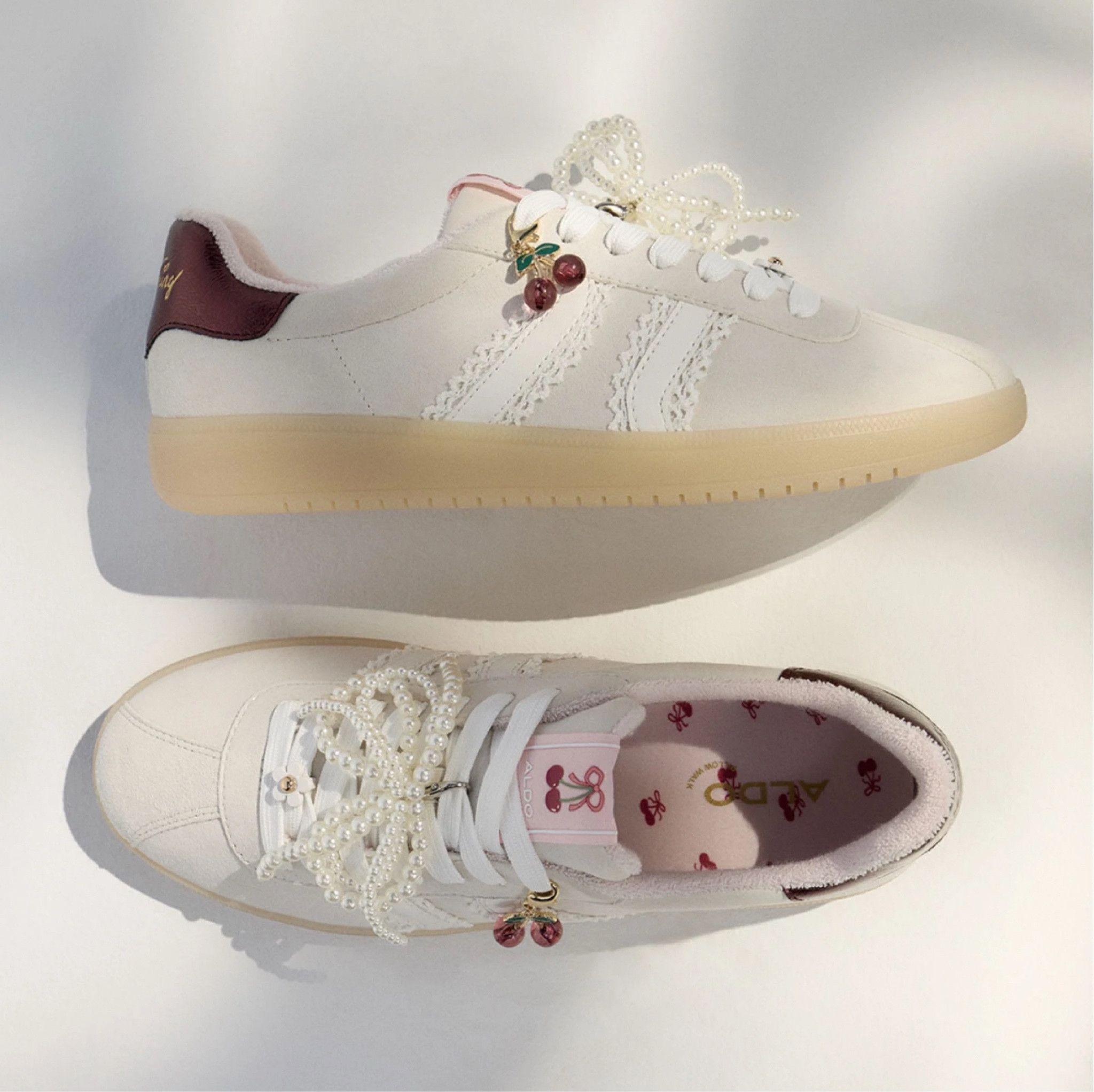 White sneaker with pearls and cherry detailing 

#LTKfindsunder100 #LTKshoecrush #LTKstyletip