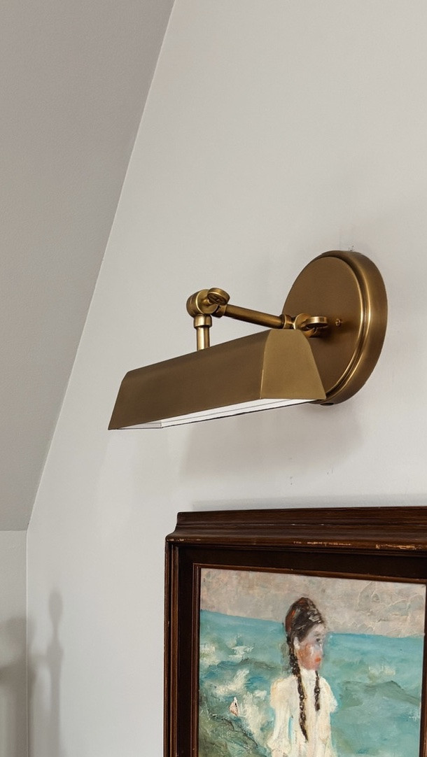 I love this picture light I got for our Snug! 🤍  I wanted a quality fixture and finish, 12 inch size, something classic and simple for this spot that would add a warm, cozy glow.

I love that the shade is adjustable so we can direct the light exactly where we want it. And it can be plugged in or hardwired, which makes it really easy to add wherever you need it!

#LTKSaleAlert #LTKHome #LTKSeasonal