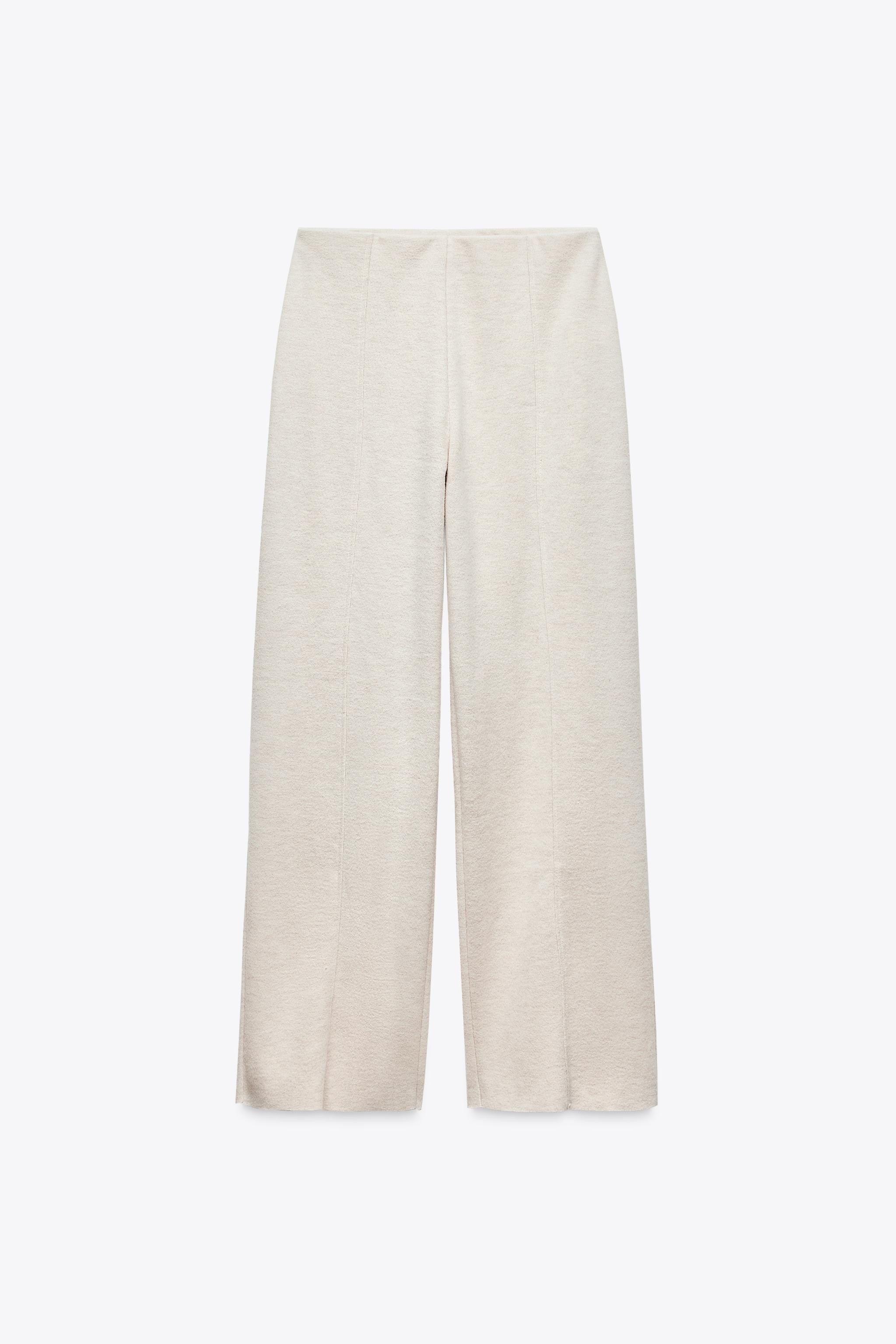 Straight leg pants with a high elastic waist. Unfinished hem. | Zara US