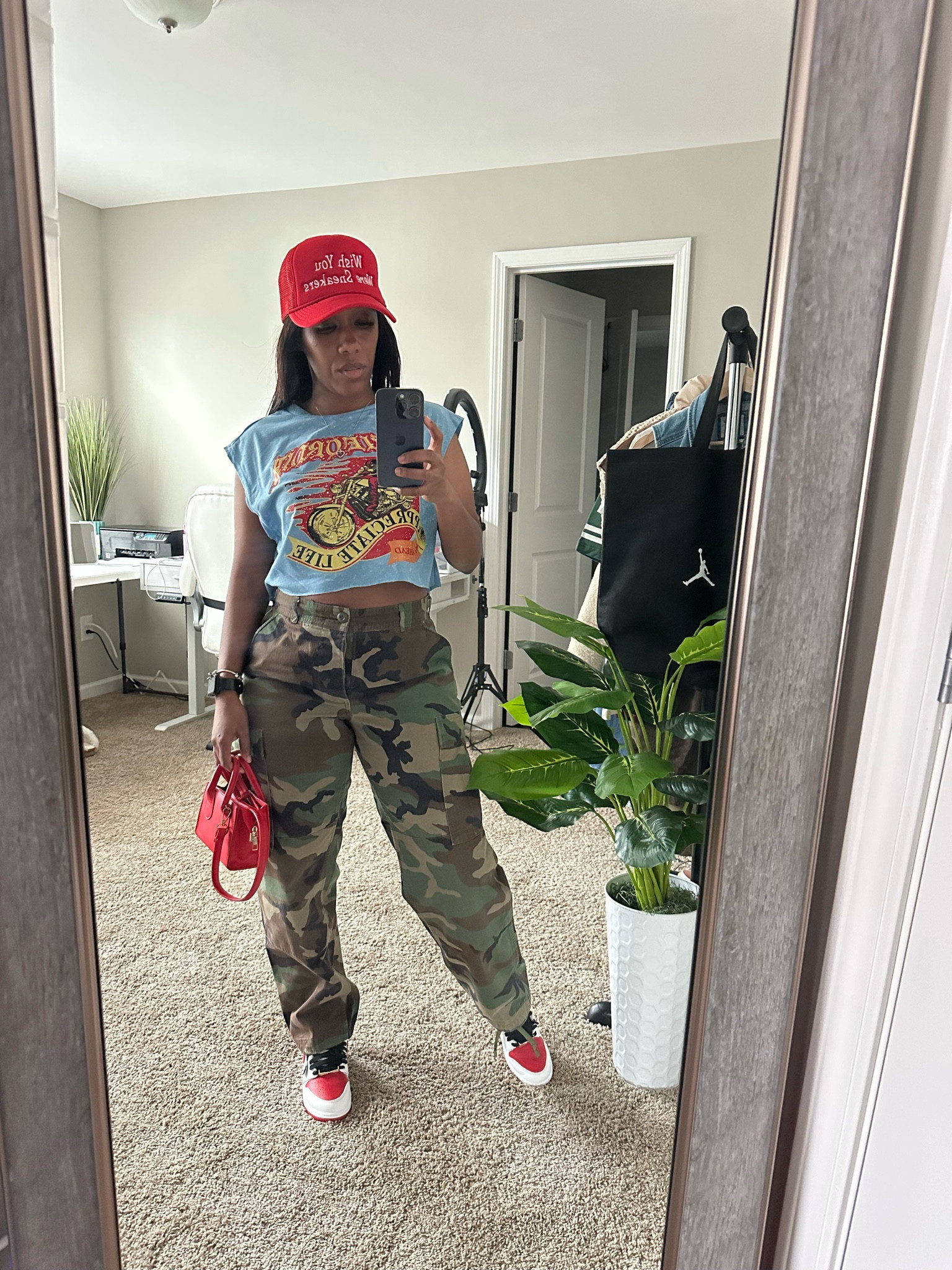 Spring outfit idea. Graphic tee crop top with camo pants. I styled this casual outfit with a red trucker hat, red purse, and Jordan 1 heritage 

#LTKStyleTip #LTKPetite #LTKFindsUnder100