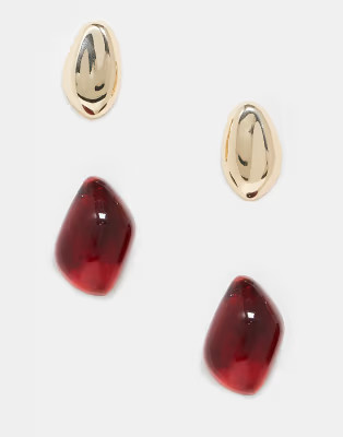ASOS DESIGN two pack stud earrings with molten design in gold and burgundy tone | ASOS | ASOS (Global)