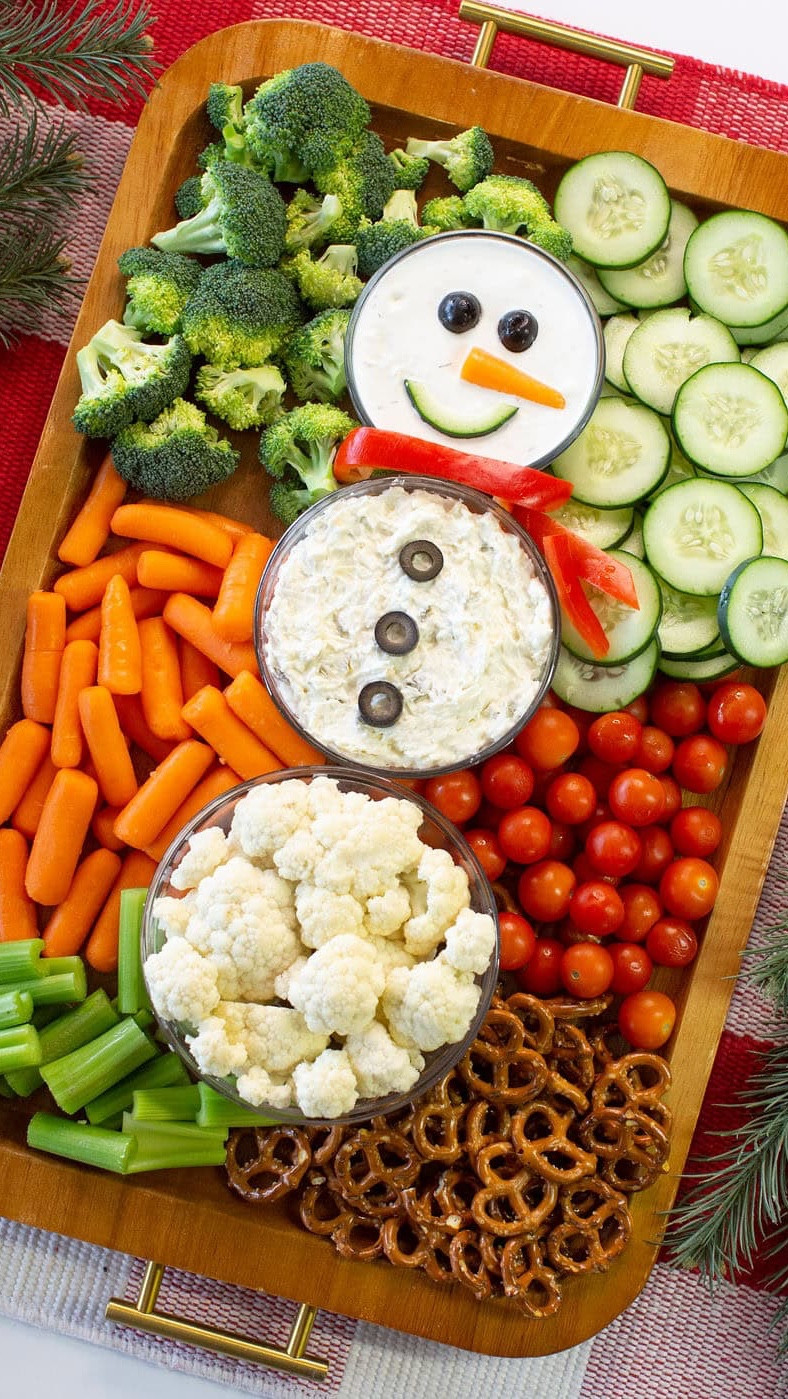 Meet the COOLEST Christmas appetizer ever… Snowman Veggie Board! ⛄️🥕 This easy appetizer is such a fun, easy way to bring holiday cheer to your table. It’s also great for a Christmas party or class party too.

Here’s how to make it:

What You’ll Need:
Broccoli • Cucumbers • Baby Carrots • Cauliflower • Cherry Tomatoes • Celery • Olives
Pretzels or crackers
Dips (I used store-bought spinach artichoke dip + ranch)

How to Assemble:

Use three dipping bowls in small, medium, and large to make the snowman body.
Fill the largest with cauliflower, the medium with spinach artichoke dip, and the smallest with ranch.
Add the face: olive eyes, a carrot nose, and a cucumber slice smile.
Add three olive slices on top of the dip for the “buttons.”
Slice a red bell pepper for the scarf.
Surround the bowls with veggies to finish the Christmas veggie tray.

It’s festive, healthy, kid-friendly, and SO cute for holiday gatherings.



#LTKSeasonal #LTKfoodie #LTKHoliday