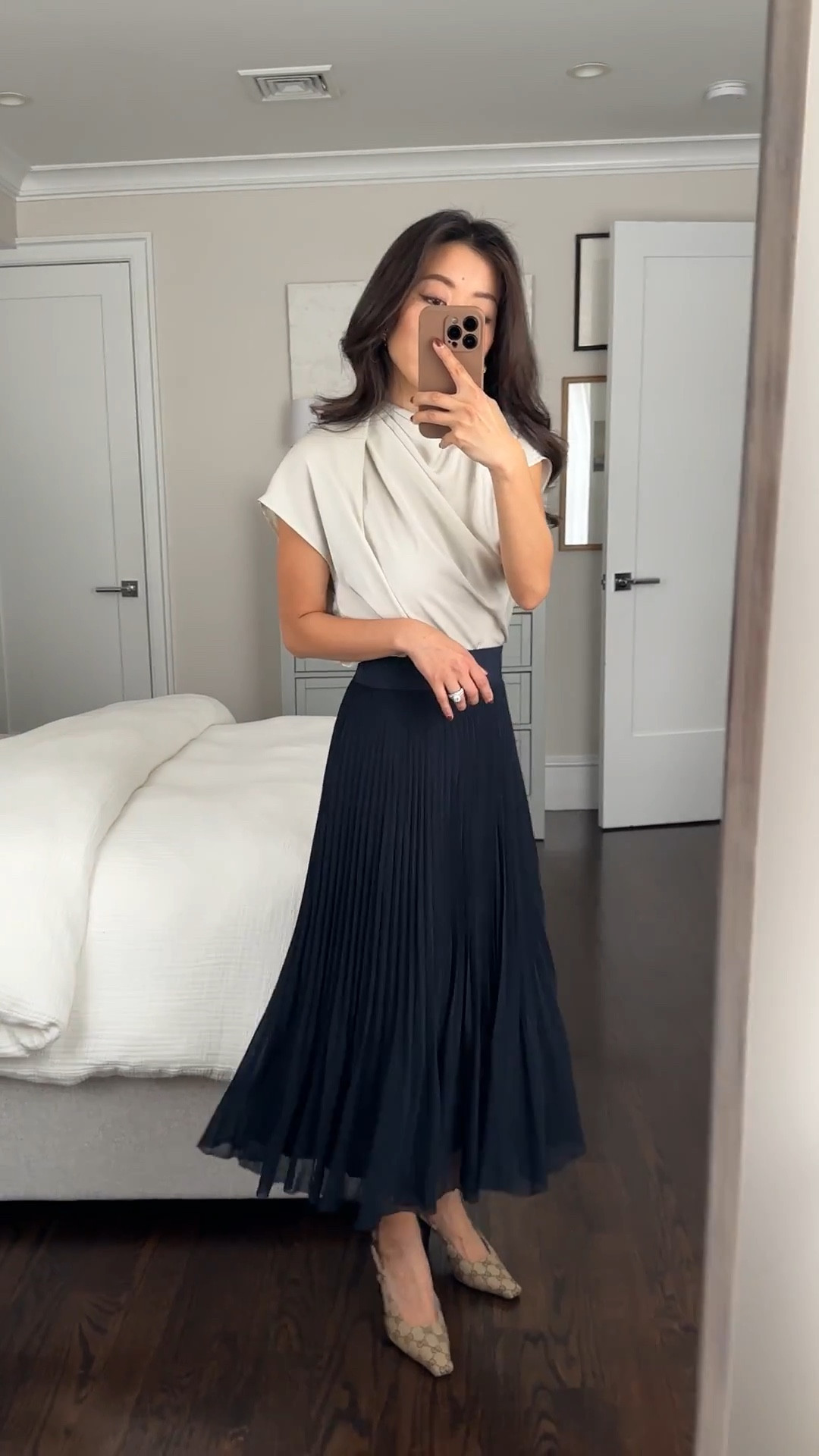 Elegant work outfit on sale! Both pieces come in several colors. Sale items are returnable for store credit and exchanges.

Also love this blouse dressed down with jeans! 

• Aritzia Satin Blouse XXS. Such a beautiful blouse with asymmetrical draping! Roomier fit with lightweight fabric that drapes and tucks in fluidly. It’s thin but not sheer with a skin toned bra for me.

•Twirl pleated skirt in navy xxs - stretchy and so floaty! Midi length on petites. More feminine , lightweight and flowier than the average pleated skirt. 

I have a 25” waist and this is the xxs which sits higher at my natural waist. 

I also tried Xs which is slightly looser on me, measures 12.25” across the elastic waist band (has stretch)

Petite friendly workwear, elegant style

#LTKFindsUnder100 #LTKPetite #LTKWorkwear