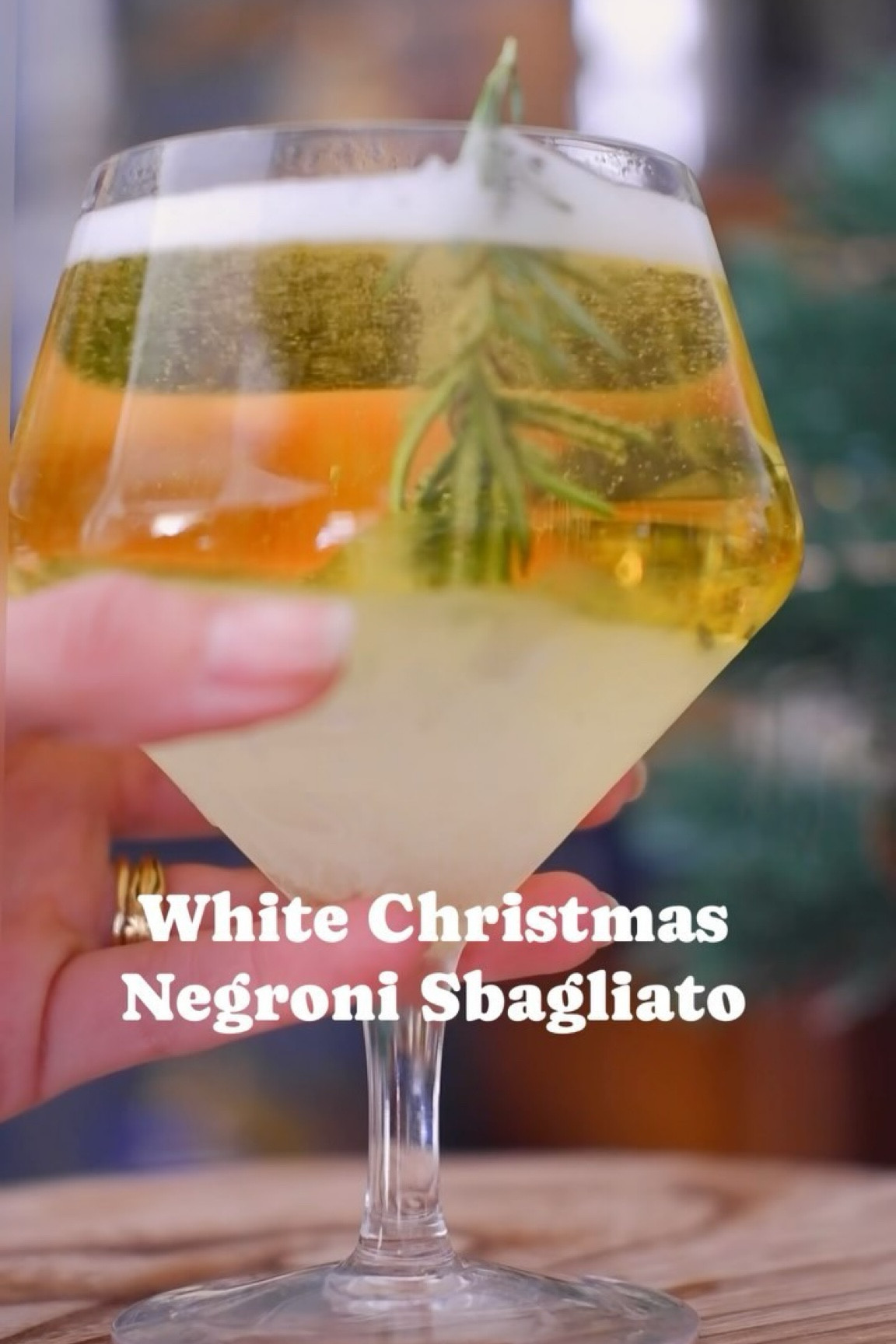 25 days of Christmas cocktails continues! 

Does anyone remember Emma Darcy sharing that their favorite cocktail is a negroni sbagliato? This is the white negroni version of that, and it’s perfect for the holidays! I again created a little rosemary Christmas tree held in the ice of the glass, so it makes it extra fun! Enjoy this lower-abv wintertime spritz!

White Christmas Negroni Sbagliato
- 1 oz Suze
- 1 oz lillet blanc
- 3-4 oz sparkling wine, preferably prosecco
- (optional) pomegranate arils

Combine all ingredients in your cocktail glass, and enjoy!

#WhiteNegroniSbagliato #HolidayCocktails #FestiveSips #25daysofchristmas #negronisbagliato #whitenegroni #rosemaryice #cocktailsnowglobe