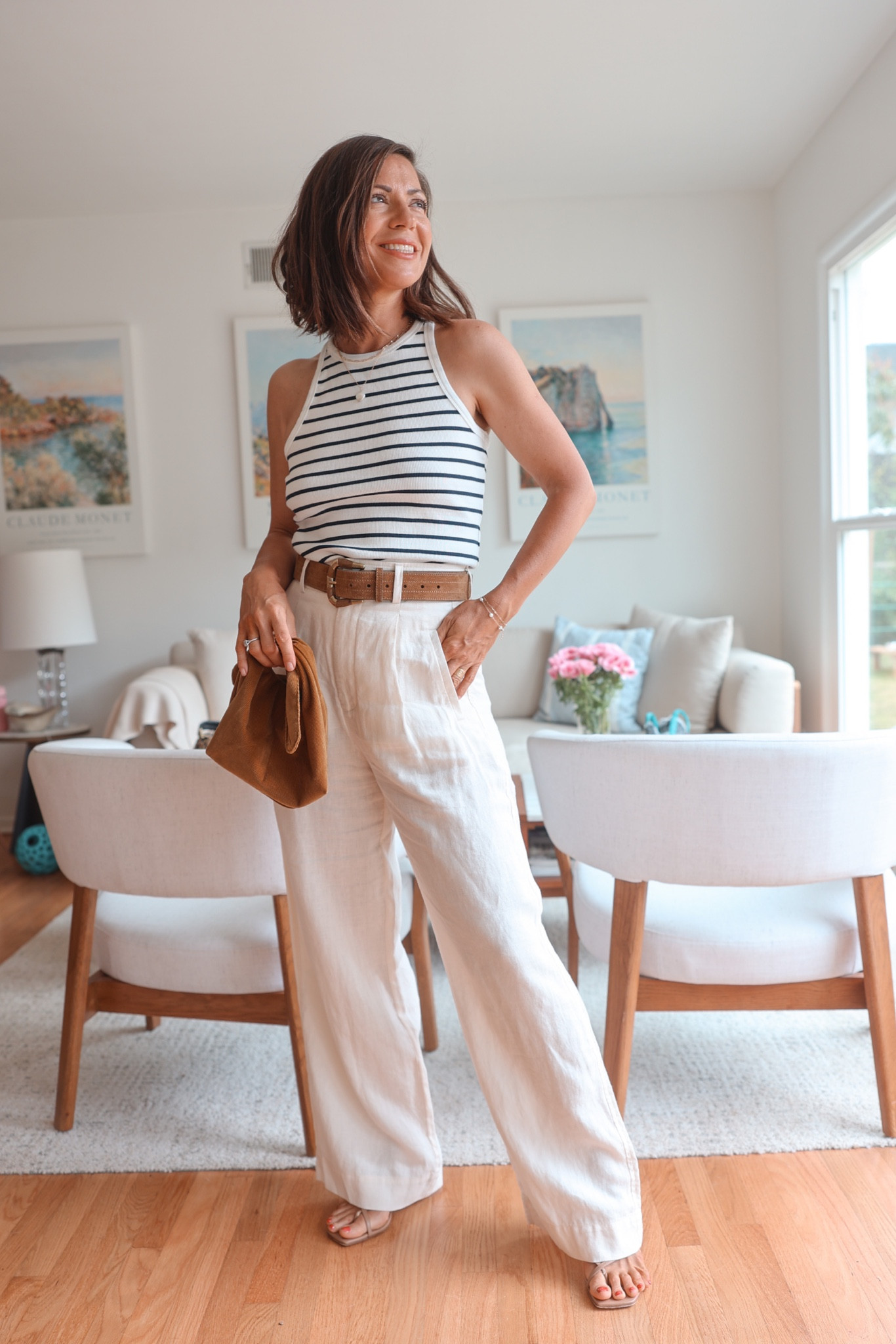 Striped tank top, linen wide leg pants, taupe belt and bag (actually a makeup bag but it went so perfectly with the outfit) and strappy sandals.

Pants: Everlane
Top & belt: Sézane (belt is older)
Bag: Merit (free with 1st ordern)
Sandals: Aeyde



#LTKworkwear #LTKstyletip #LTKeurope