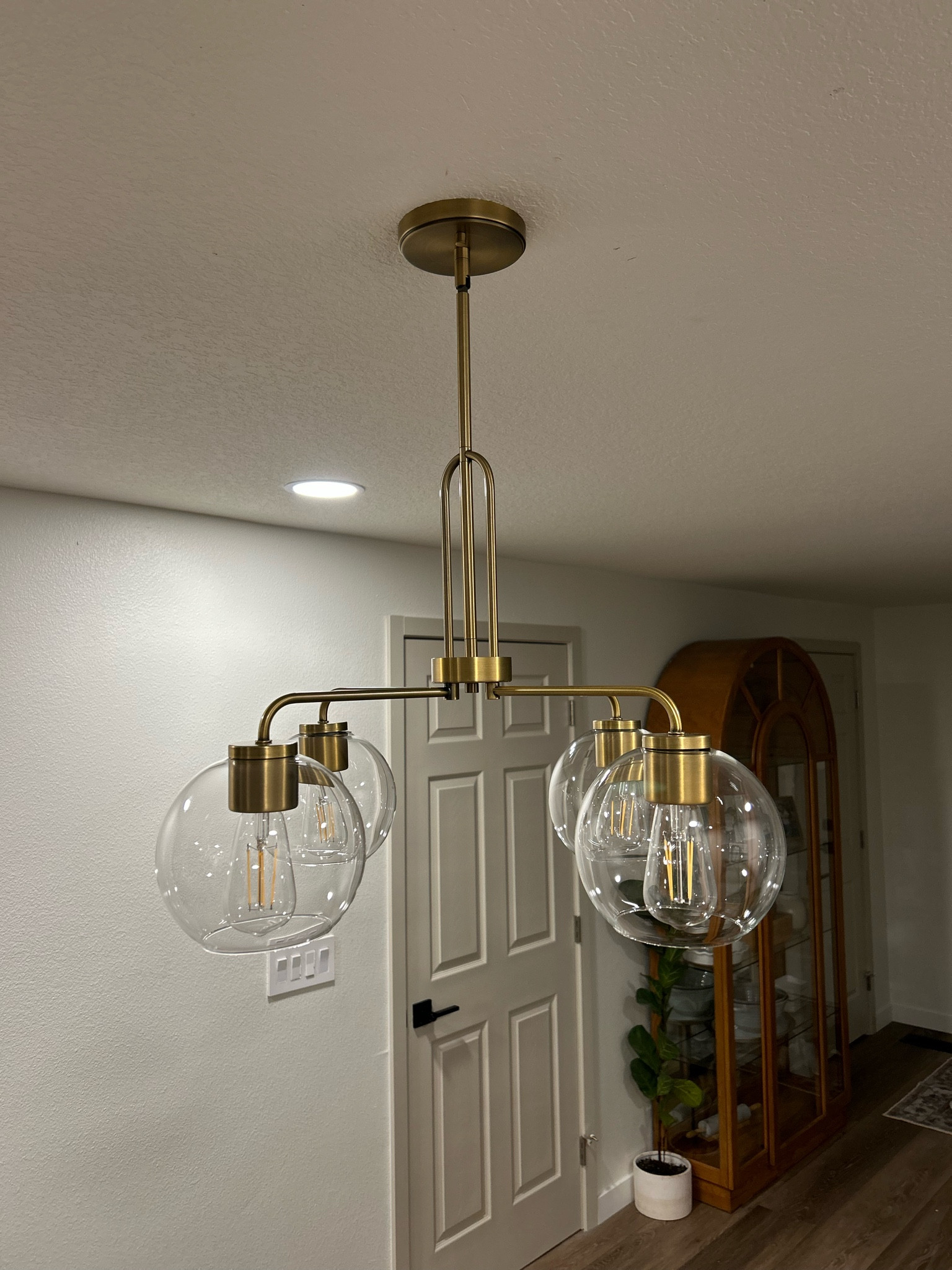 Gorgeous antique brass gold chandelier for our dining room 💛 the perfect touch of modern details while keeping a simple elegance to it! 

I love how the arched detail compliments my arched cabinet 😍 I have been searching for the perfect chandelier for over 2 months and I have finally found it!

The minimum height for this globe chandelier is perfect for 8ft ceilings, it also comes with more bars to make it longer for those of you with taller ceilings (I’m jealous 😜). 

#LTKhome