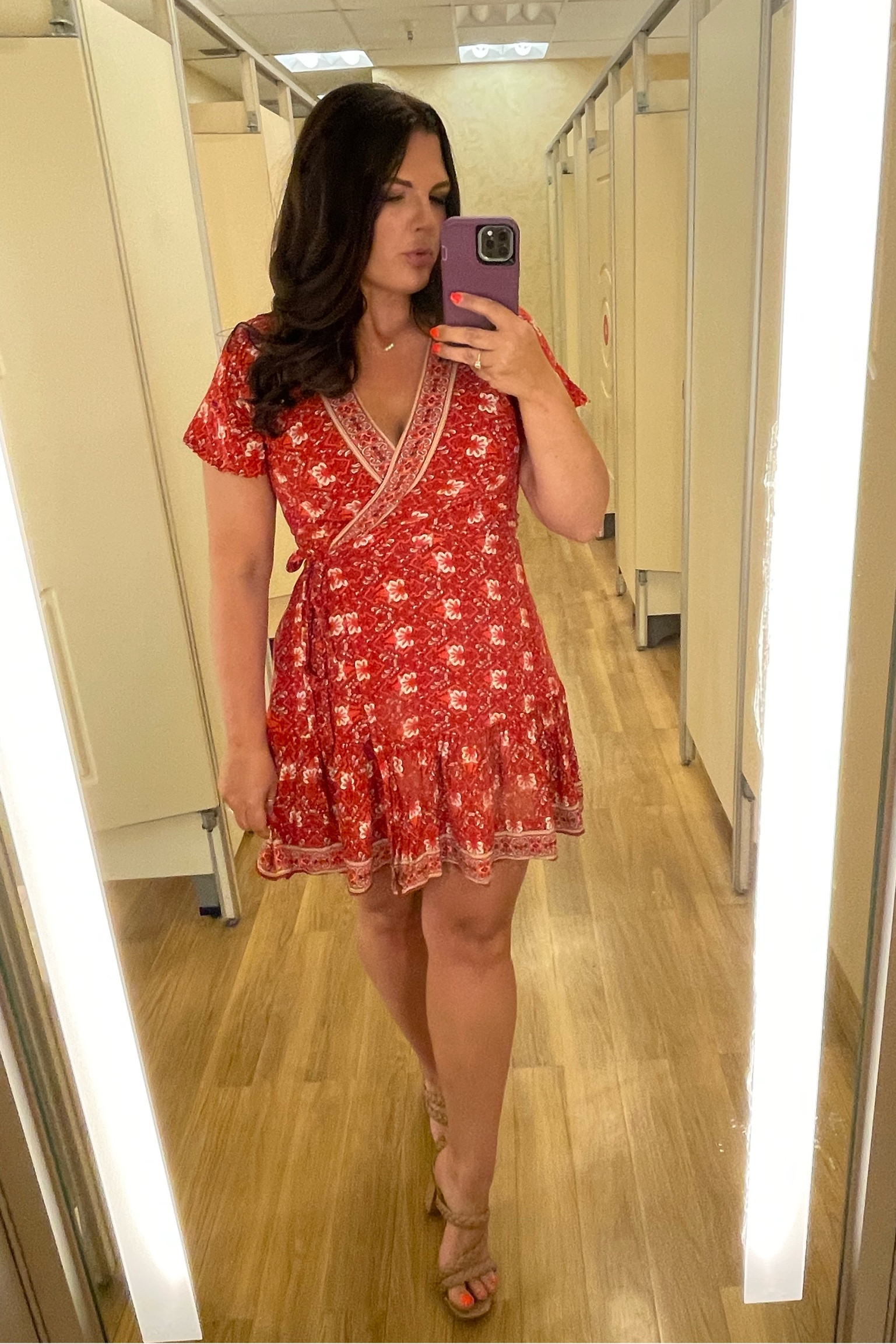 Wrap Dress wearing size L. It covers the booty well 😜 I’ve had it two years and wear it all the time. Summer dress, vacation dress, or lawn party dress. 