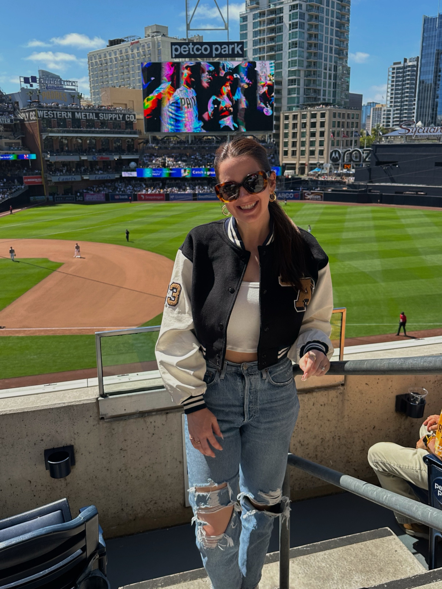 Revolve cropped varsity jacket and tank, agolde jeans, Gorjana hoop earrings, Celine sunglasses 

#LTKTravel #LTKStyleTip