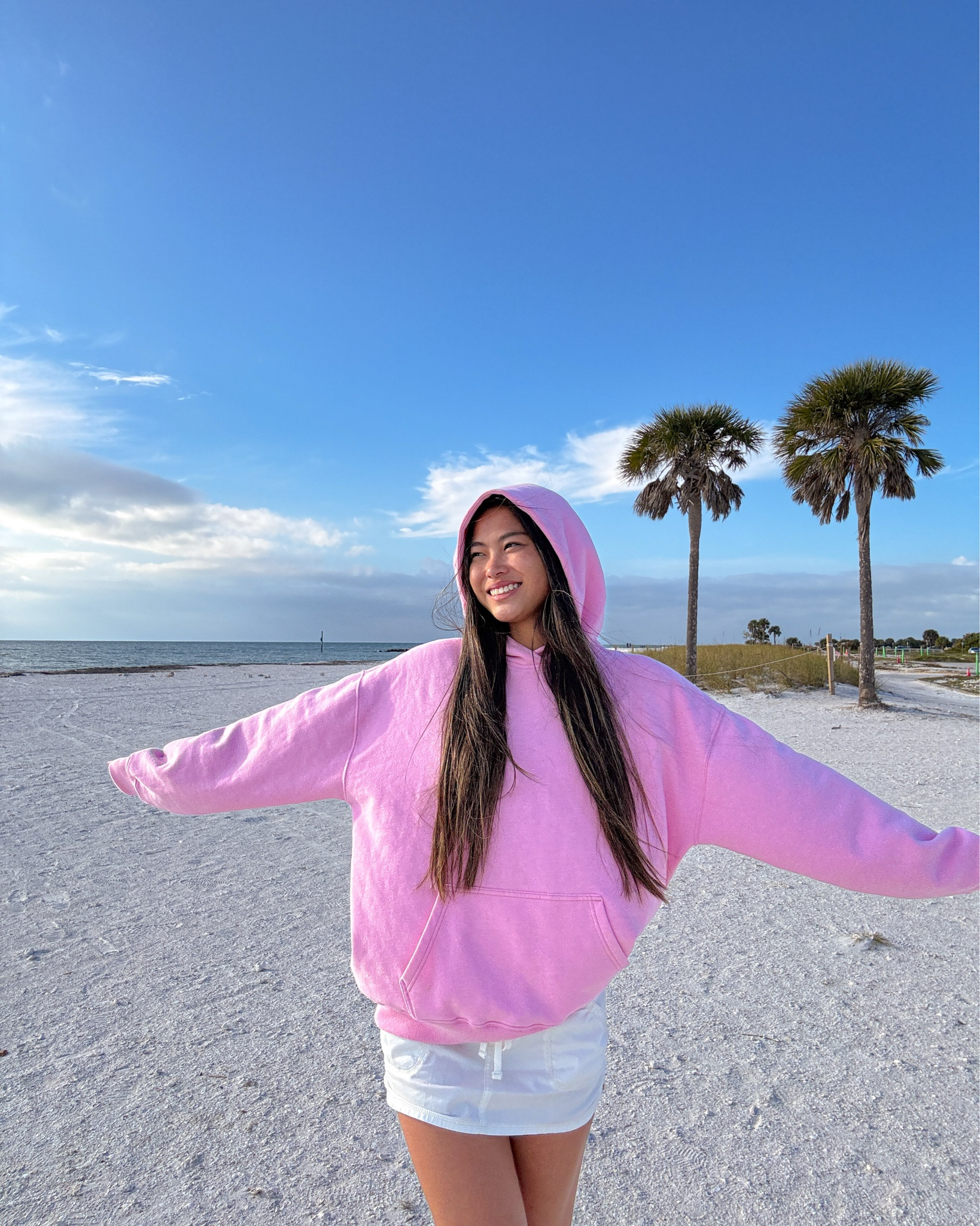 spring break cozy outfit inspo | hoodie has an oversized fit, I am wearing a size XS. skirt is short but has built-in shorts! hoodie, skort, flip flops, and beach tote are linked.

#LTKgrwm #LTKootd #LTKTravel