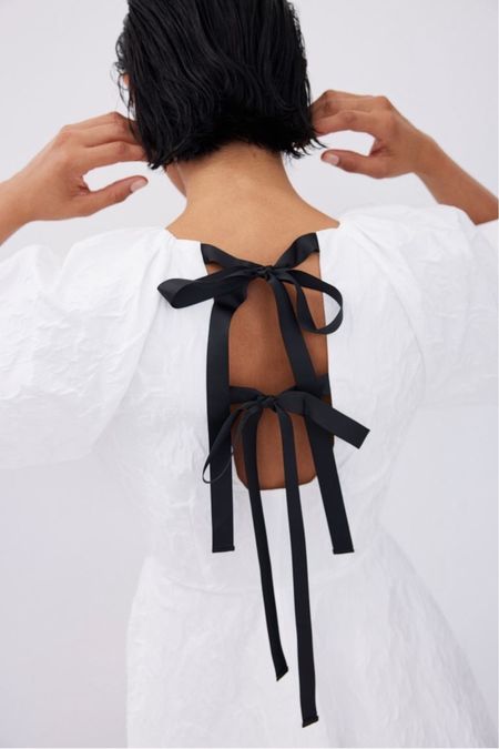 Tie back white puff sleeve dress 

#LTKstyletip #LTKSeasonal #LTKfindsunder50