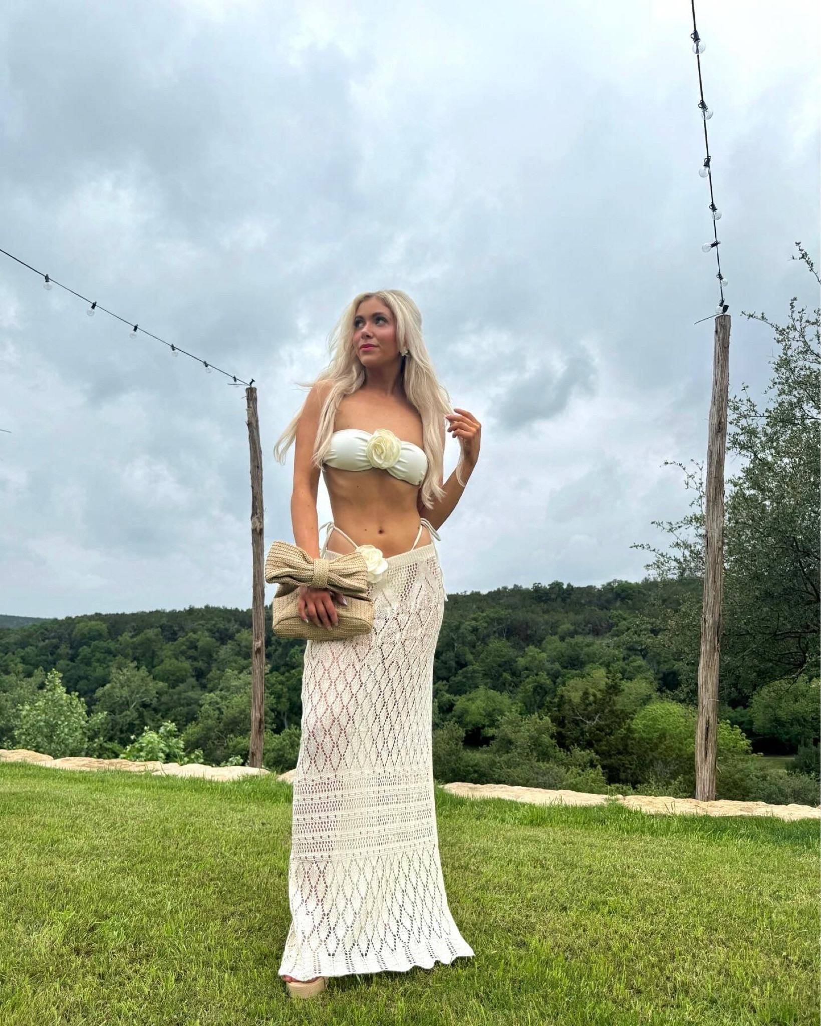 Flower bikini, beige swimsuit, crochet skirt, split hem maxi skirt, bow handbag, pool party outfit, mansion party, beach outfit, beach skirt, vacation outfit, vacation style, daisy claw clip, straw bow purse, straw handbag, Texas fashion, Austin Texas, chic style, casual chic, old money aesthetic, wedges, platform shoes, summer shoes, spring fashion, summer fashion, pool day, chunk peep toe mule sandals, heeled sandals