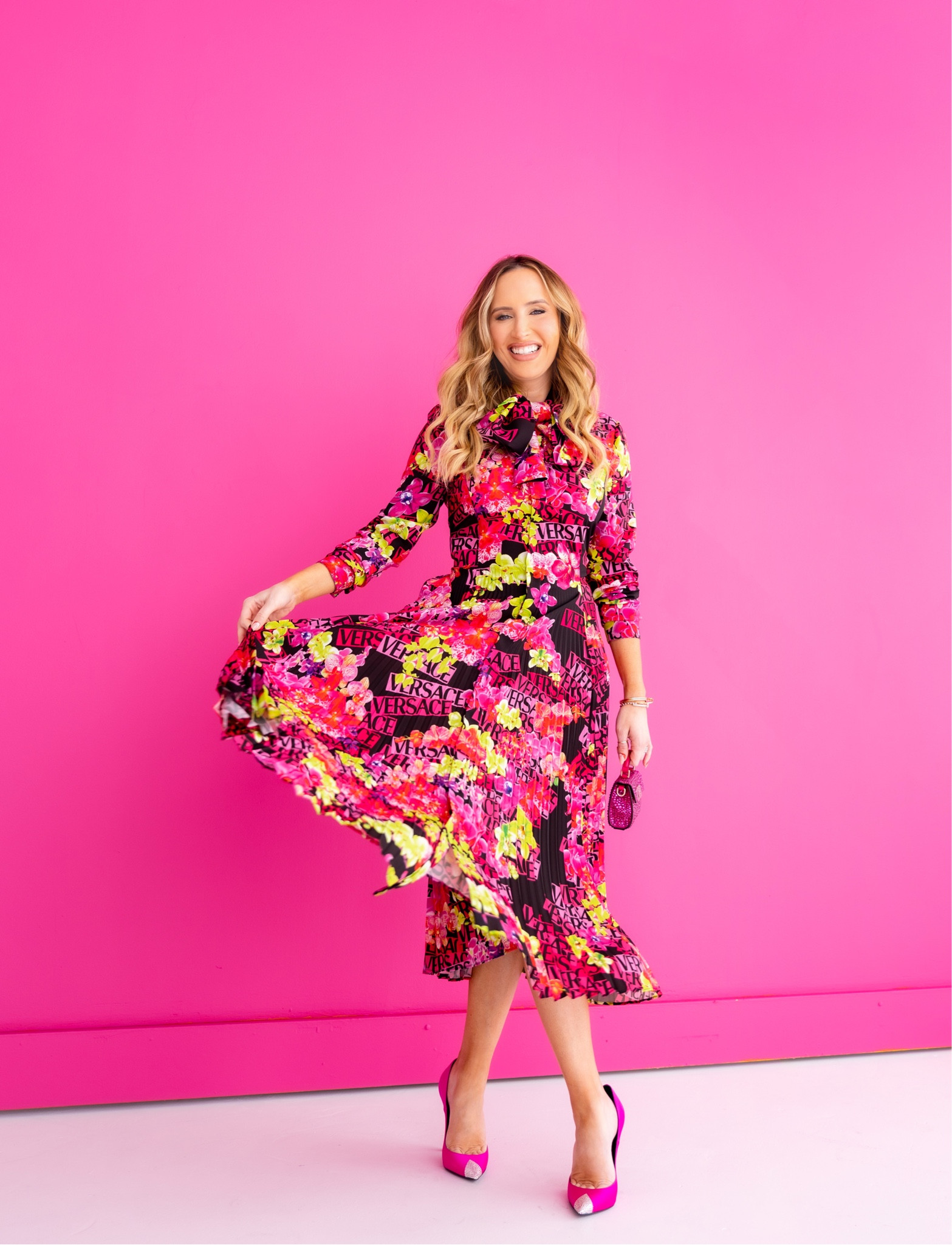 Pink floral print and sparkling accessories for a chic and elevated Valentines Day! 💖 I linked this whole look which is a splurge, but found similar styles for less and added them to this post. I love the pink crystal mini bag (and wear mine often) combined with hot pink pumps whether it’s for a casual or dressier look. This Versace dress is stunning and fits so well! But I also found other fun floral print dresses that pack a punch as well! 

#highlow #versace #floraldress #versacedress  #pinkshoes #galentines #galentineslook #valentino #valentinobag #crystalbag #minibag #valentinesday #valentinesdaydress #valentinesdaylook #valentinesdaystyle #ootd #galentineslook 

#LTKitbag #LTKstyletip #LTKSeasonal