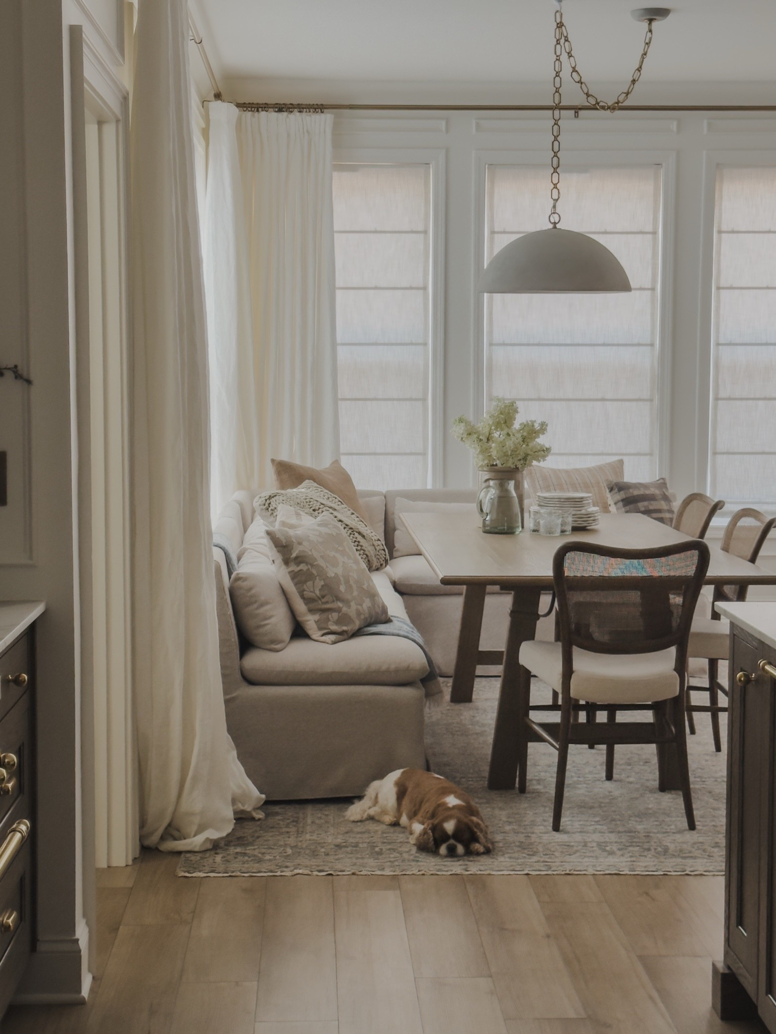 Bright and airy breakfast nook with a cozy, collected style. A few functional and aesthetic table items, my favorite Loloi pillows, and stunning linen details for a timeless and inspired space.

Home finds, neutral home inspo, collected style, breakfast nook details, linen banquette, dining table details, wooden dining chair, pendant lighting, linen shades, linen curtains, bright and airy, cozy throw pillow, faux floral, Loloi, Four Hands, Arhaus, Amber Lewis, Two Pages, Pottery Barn style, Crate and Barrel, shop the look!

#LTKSeasonal #LTKHome