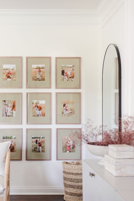 Spray painted picture frames and mats, large arched floor mirror, mauve dried florals, grid gallery wall, family portrait gallery wall, family photo gallery wall

#LTKunder100 #LTKhome #LTKSeasonal