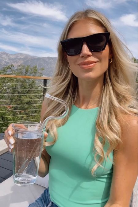 From IG Reel: I adore this compression tank and would love to have it in every color! These sunnies have been a fun cheapy that I wear all the time! 

#LTKSeasonal #LTKunder50