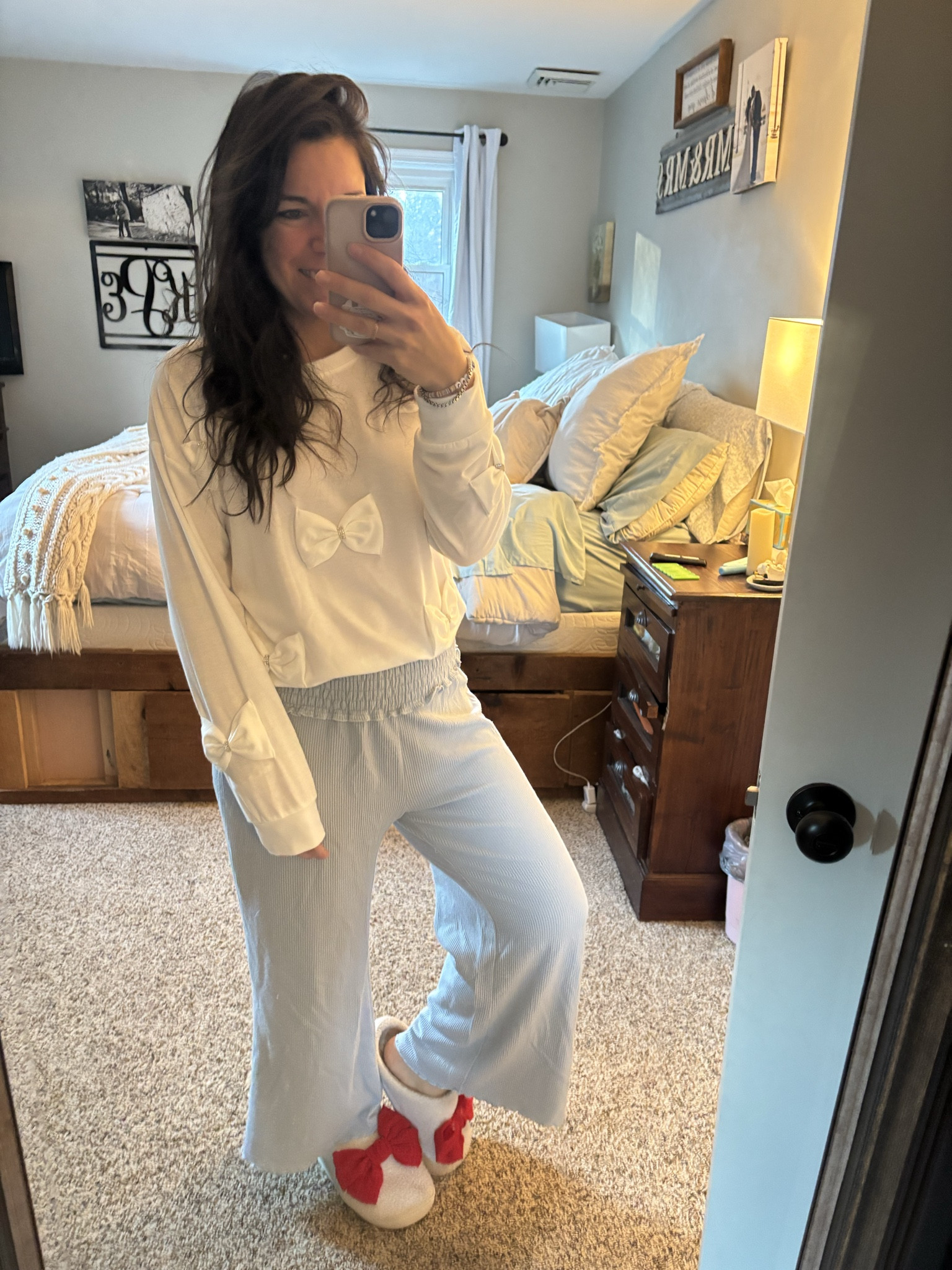 Obsessed with this bow sweatshirt I can dress up or down! And it was less that $10 at Boscovs! #LTKOOTD 

 #LTKGiftGuide #LTKHoliday #LTKgrwm