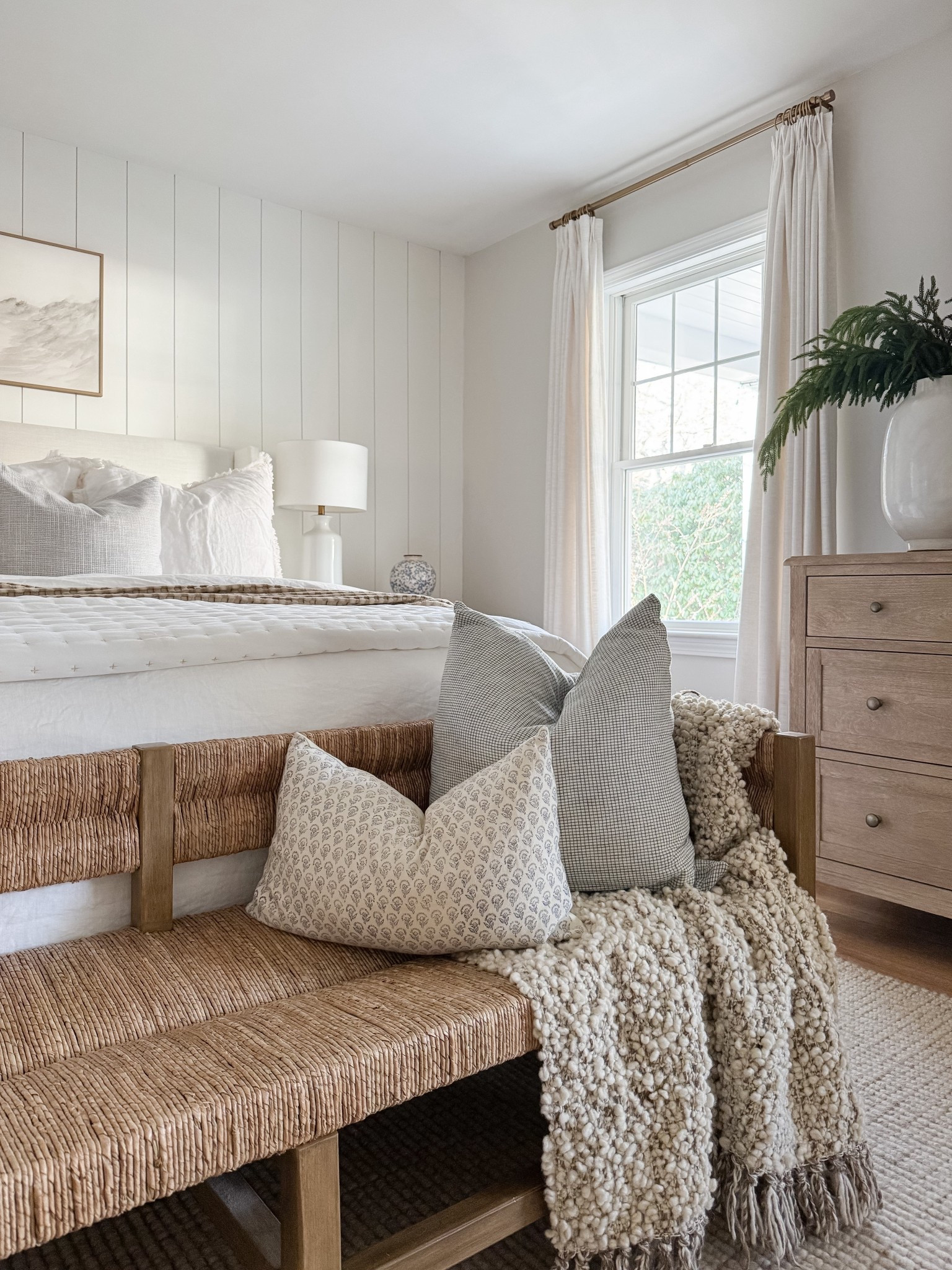 Layered bedding, warm wood tones, and soft textures make this coastal bedroom feel calm and complete. coastal bedroom decor, neutral bedroom, upholstered bed, woven bench, coastal home style, serene bedroom, timeless interiors, bedroom inspiration, sherricalnanhome

#LTKHome #LTKFindsUnder50