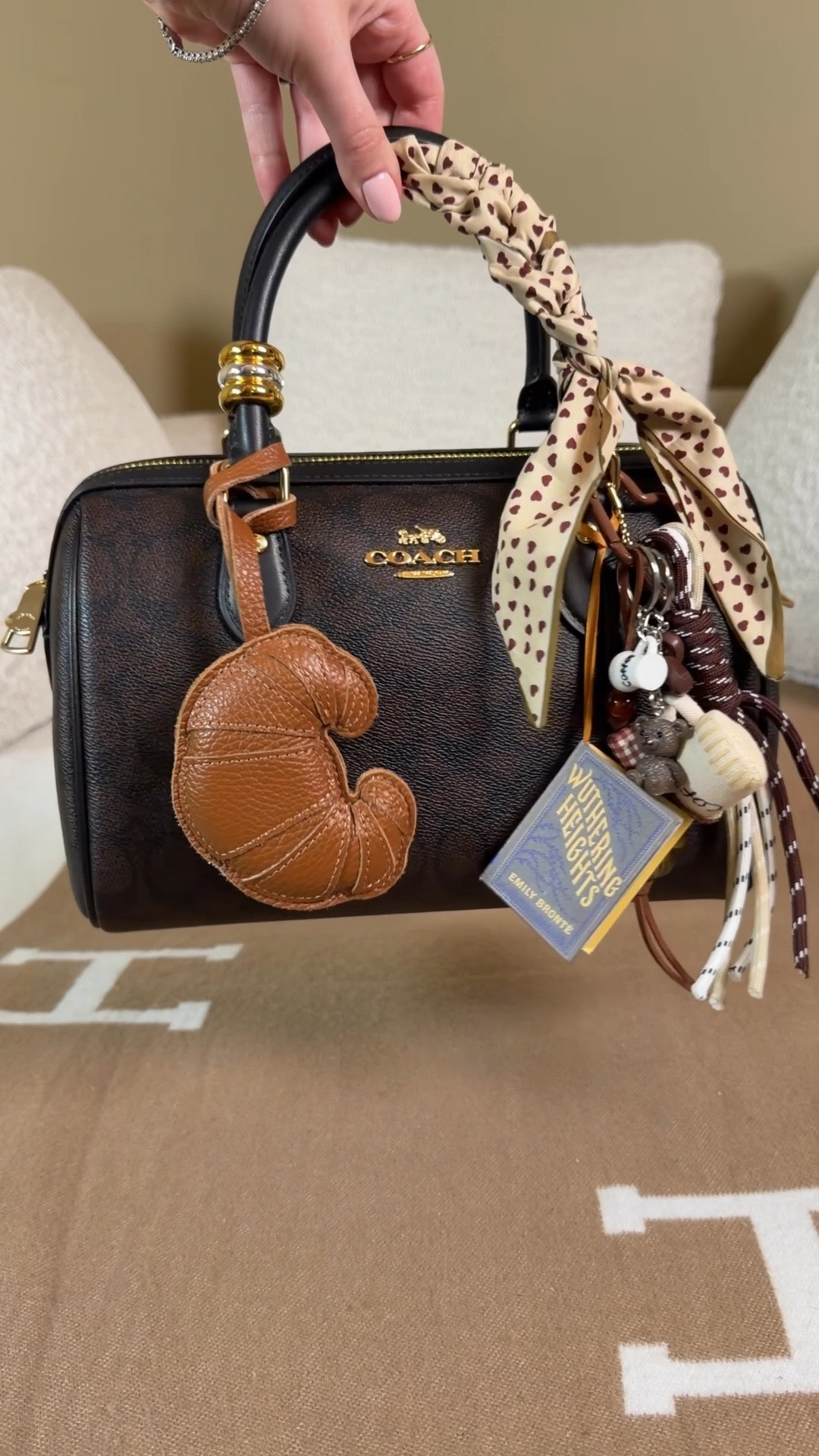 What fits in the medium Coach Rowan?

This is one of the most popular Coach outlet bags (and for good reason)! It is not only a beautiful bag but it’s such a great everyday size! 
She can be worn as a hand bag with her chic little handles or she also comes with a crossbody strap.

What’s in my bag:
Mini Rowan charm from the Coach outlet 
Touchland hand sanitizer
Light up mini compact mirror
Tom ford mini lipstick
Coach outlet maple zip card holder wallet
Glasses protector holder 
Cute glasses case
Salt and stone hand cream
Tula spresso energizing eye balm
Madewell bead clip bag charms
Leather croissant charm
Wuthering heights mini book charm

Coach outlet medium Rowan satchel 

#LTKMothersDay #LTKgrwm #LTKootd