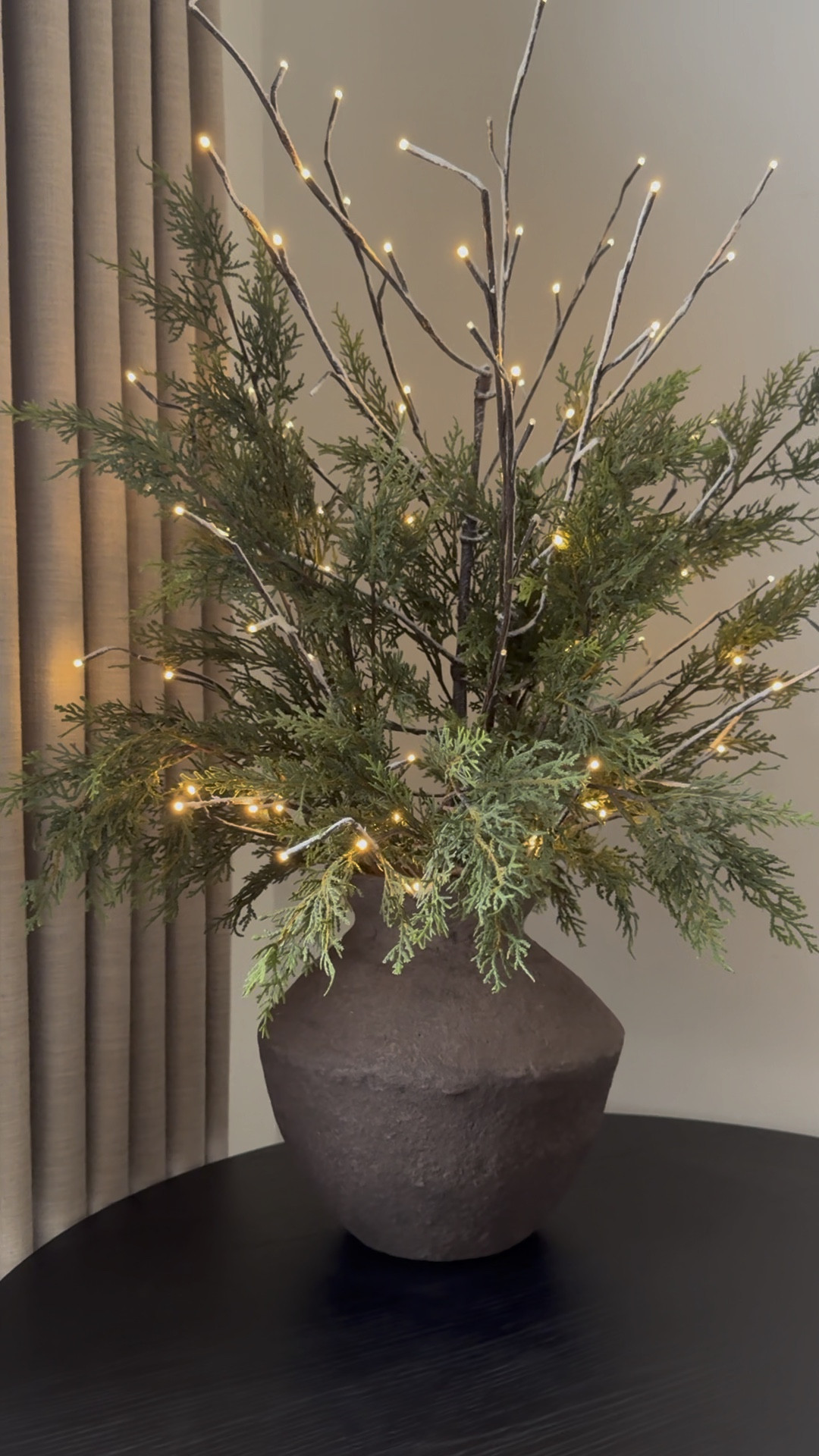 Festive yet simple arrangement in brown paper mache vase. The curtains are the color “Burlywood Birch” 

#LTKHoliday #LTKHome #LTKWatchNow