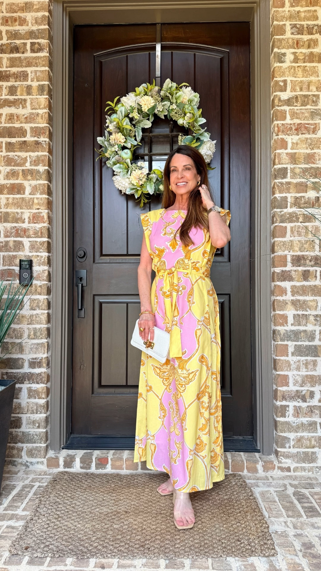 This beautiful pink and yellow drss is perfect for all of your Spring and Summer occasions. Think weddings, Mother’s Day, bridal showers and more. I’m wearing mine to dinner on the French Riviera.

It’s a midi on others, but a maxi on me ar 5’1”. Wearing size small. I linked all of my accessories too.
