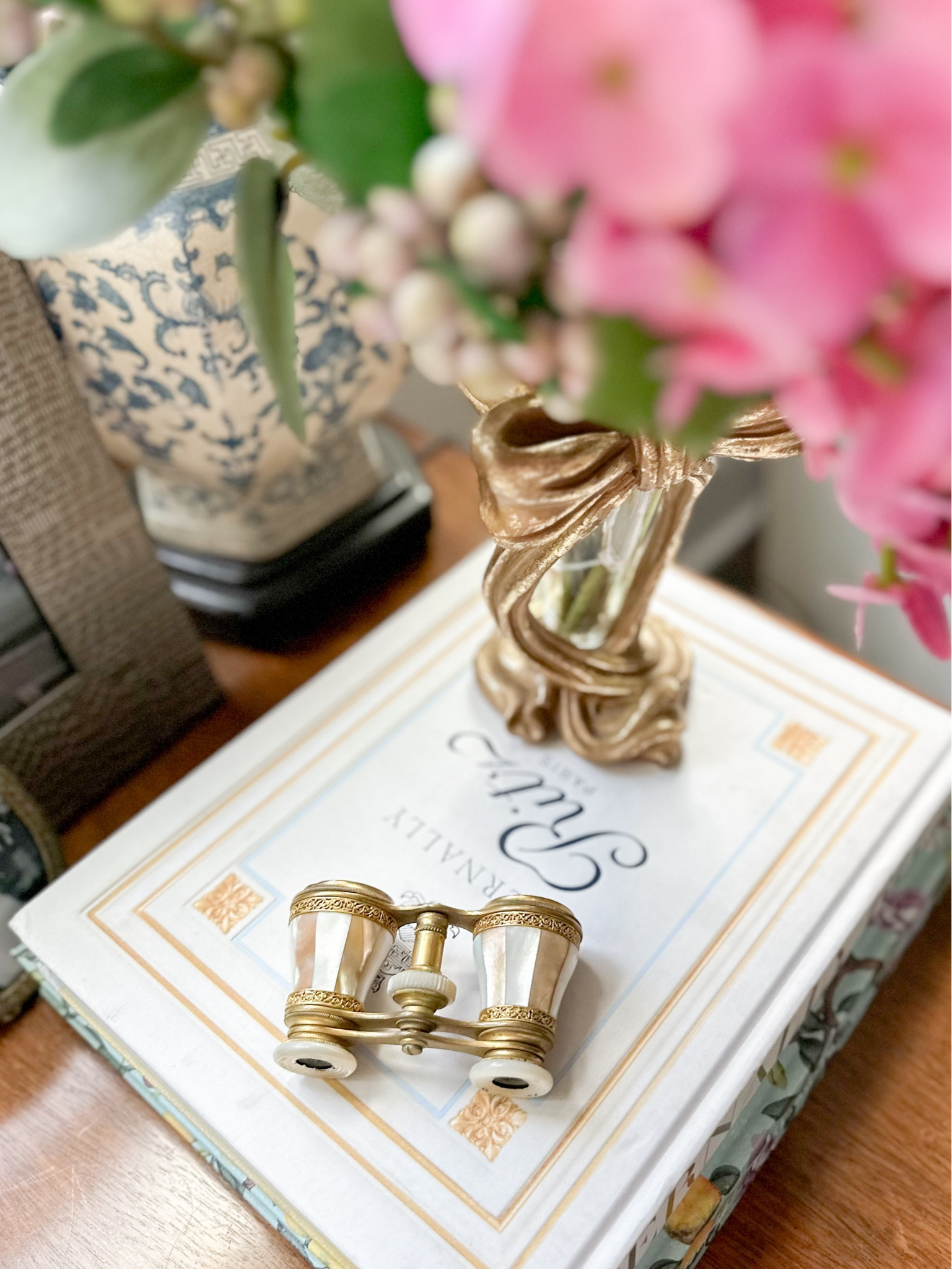 Coffee table book stack styling with vintage opera glasses and vase. 

#LTKfamily #LTKhome