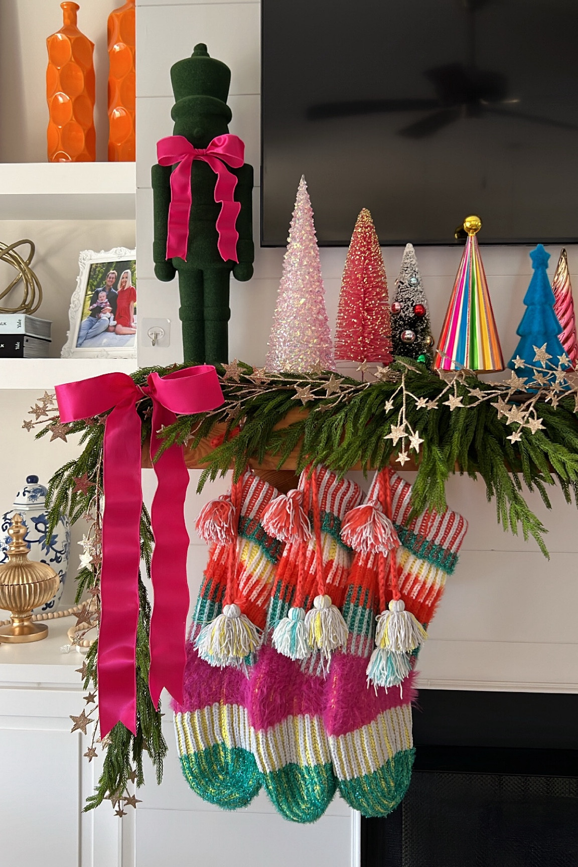 Norfolk pine garland (I used 3 pieces) / metallic star garland / colorful Christmas mantle / multicolored Christmas decorations / pink Christmas mantle decorations 

#LTKHome #LTKHoliday