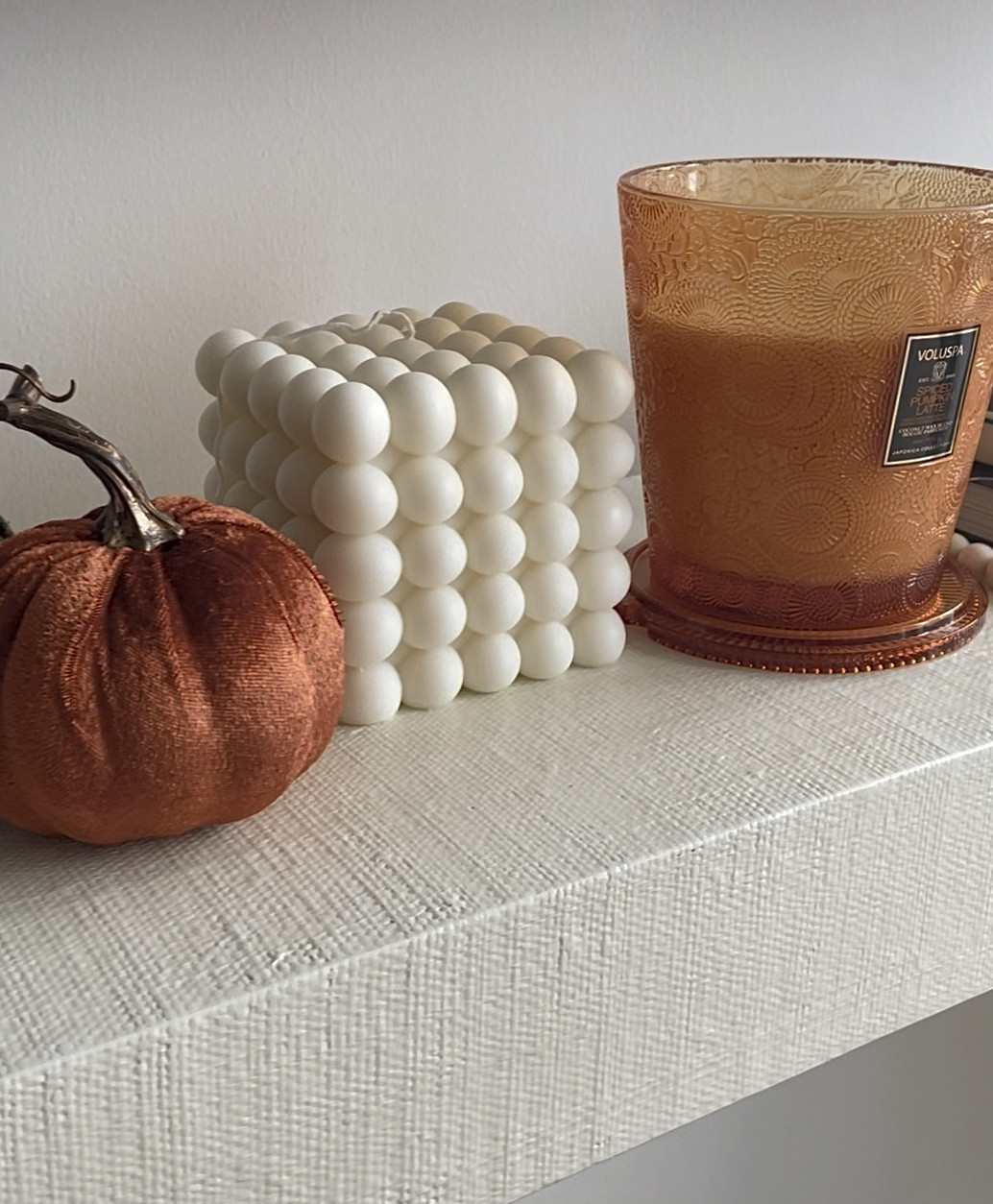 Fall mantle! Velvet pumpkins, home decor, decorative candles, pumpkin spice latte candle, fucking fabulous Tom for candle, le labo santal 26 candle, coffee table book, autumn decor, fall scents, seasonal obsessions, fall inspo 

#LTKHalloween #LTKhome #LTKSeasonal