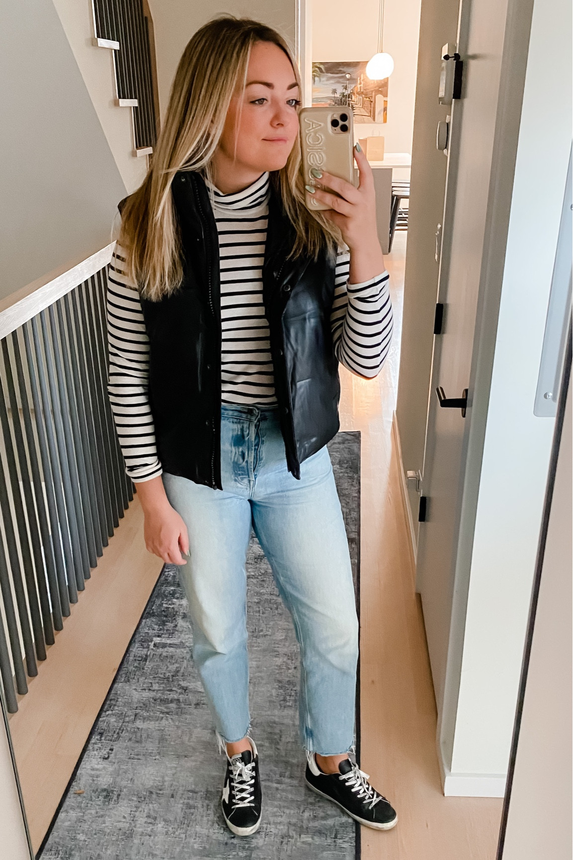 Faux leather puffer vest - under $50! Wearing a medium.
Striped tissue turtleneck - TTS.
Straight leg 90s jeans. - TTS
Golden goose sneakers. - Normally a 8.5 and I take a 39 in Superstars.

#LTKunder50 #LTKstyletip #LTKSeasonal