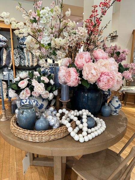 Spring flowers and spring home decor items from Pottery Barn!  Faux flowers, navy blue vase, blue and white terracotta vase, blue vases, white decorative beads, blue and white Easter eggs and round seagrass tray.

#ltkpotterybarn #ltkspring

#LTKSeasonal #LTKhome #LTKstyletip
