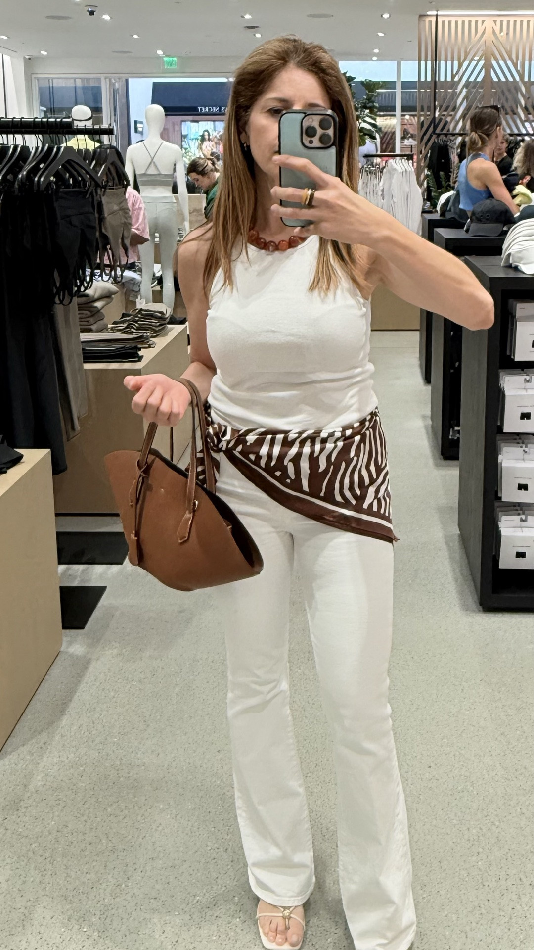 A basic monochromatic look always creates a more elongated silhouette on petites 🤍

Then I added this scarf detail at the waist to softly define shape and elevate the whole outfit ✨

I also keep these jeans long intentionally because the extra length creates the illusion of longer legs. Instead of hemming them, I pair them with a small heel to keep the proportions balanced.

For reference:
Jeans 24  
9.75” rise  
31” inseam  
20” leg opening  

Top: S  
Shoes: size 7  
2.25” heel height  

Linked below

#LTKMothersDay #LTKootd #LTKPetite