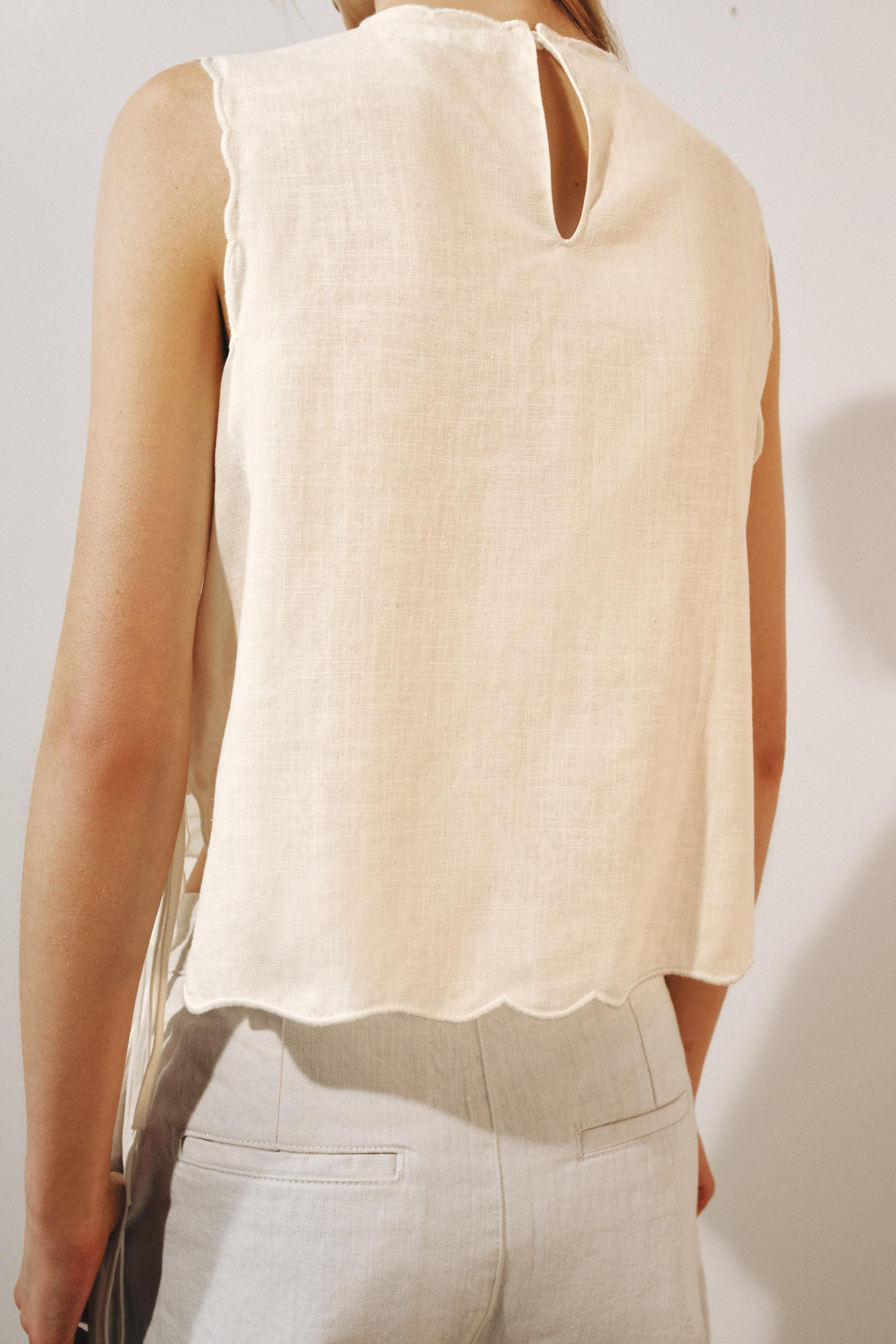 ZARA WOMAN COLLECTIONShirt made from a ramie blend. Round neck and sleeveless cut. Featuring matc... | Zara US