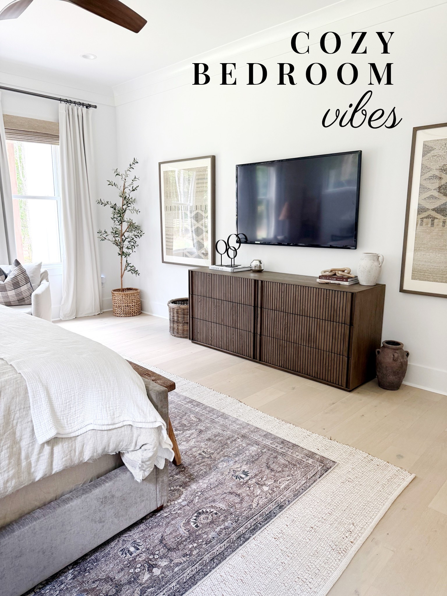 Cozy bedroom vibes with layered rugs, warm long wooden dresser and framed tapestries 🤍 

#LTKStyleTip #LTKHome