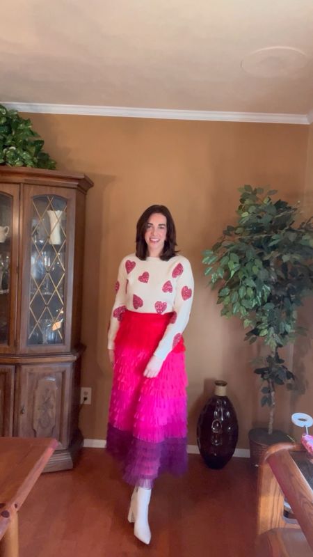 Valentine’s Day Outfit - Heart Sweater (size small). Ruffled pink maxi skirt (size small). White boots (size small). #heartsweater #sweater #sweaters #skirt #ruffledskirt #boots #whiteboots #winteroutfit #maxiskirt 

#LTKstyletip #LTKSeasonal #LTKfindsunder100