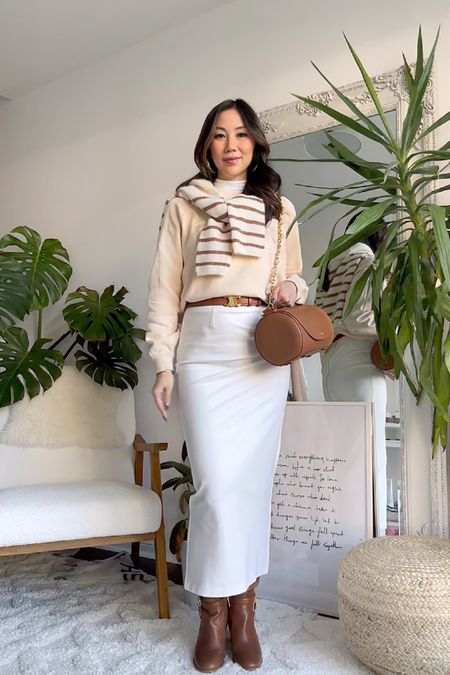 A classy and chic neutral outfit with a sweatshirt and striped sweater from Sezane, paired with a maxi skirt from Karen Millen. And accessorized with knee-high boots from Michael Kors, a Celine belt and bag from Senreve. Dressing my bump at 17 weeks pregnant for the office. 

#LTKworkwear #LTKbump #LTKitbag